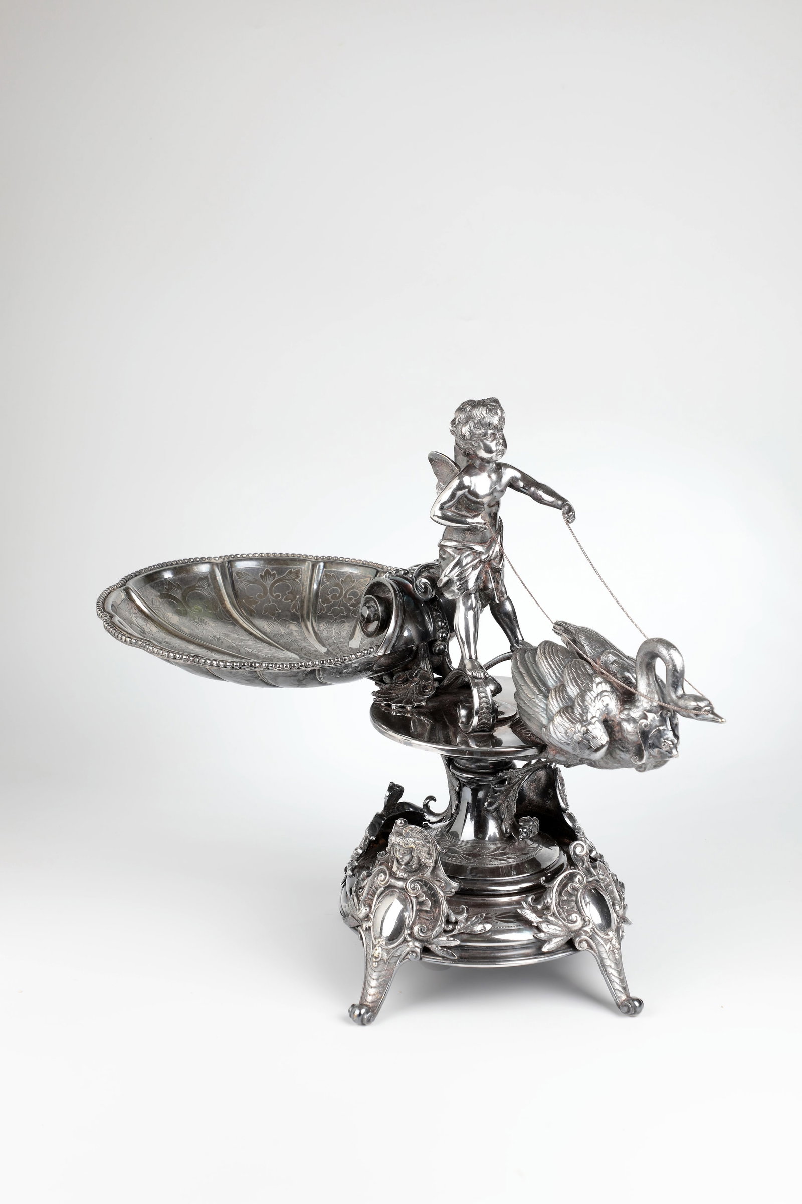 Figurative centerpiece: Figurative centrepiece Germany or France, 2nd half of the 19th century, metal, cast, partly embossed, silver-plated, screwed. On four volute feet with rocailles and foliage, two with additional female