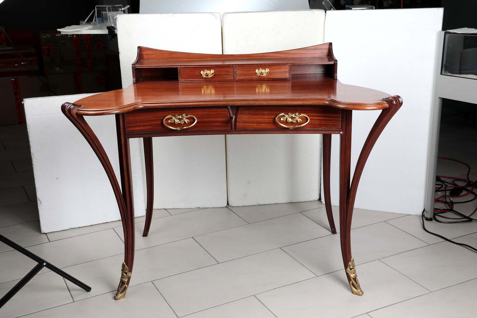 Bonheur-du-jour (ladies' desk with top): Bonheur-du-jour (ladies' desk with top) Louis Majorelle, Nancy, circa 1900 Mahogany and mahogany veneer with finely curved asymmetrical top on swinging legs with floral bronze sabots. Top with two sma