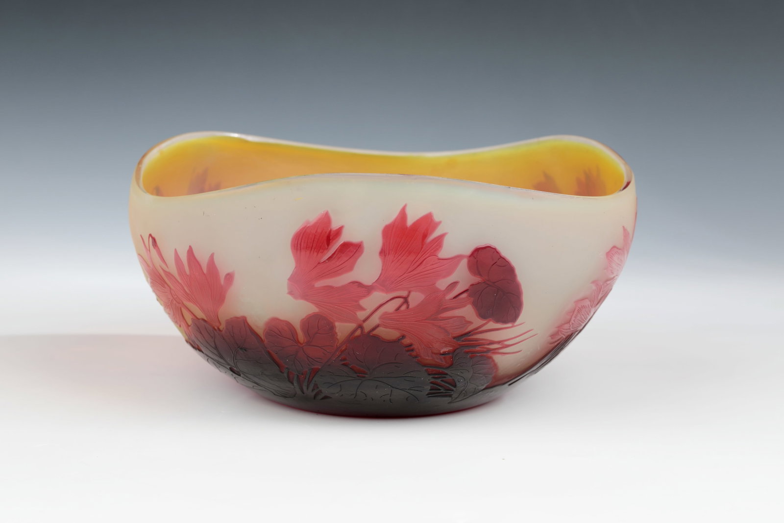 Bowl ''Cyclamens'': Bowl ''Cyclamens'' Etablissements Gallé, Nancy, around 1920 Colourless glass, slightly opal underpinning. Lemon yellow and burgundy overlay. Etched decoration in relief all around: flowers, buds