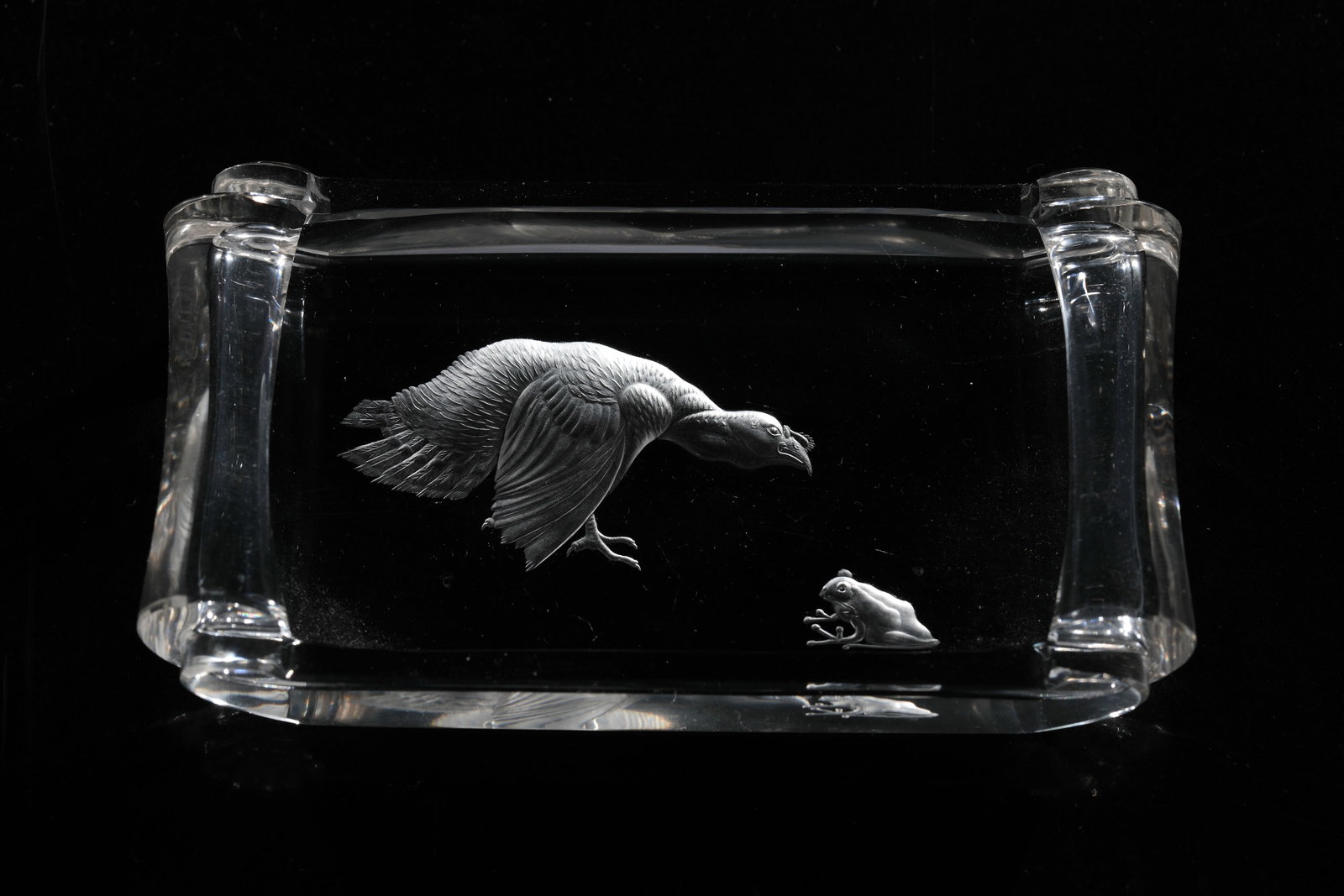 Business card tray: Business card bowl Max Rössler (attributed), North Bohemia, c. 1930 Colourless glass. Rectangular shape with rolled ends and polished edges. Very fine engraving in the bottom: condor and frog.