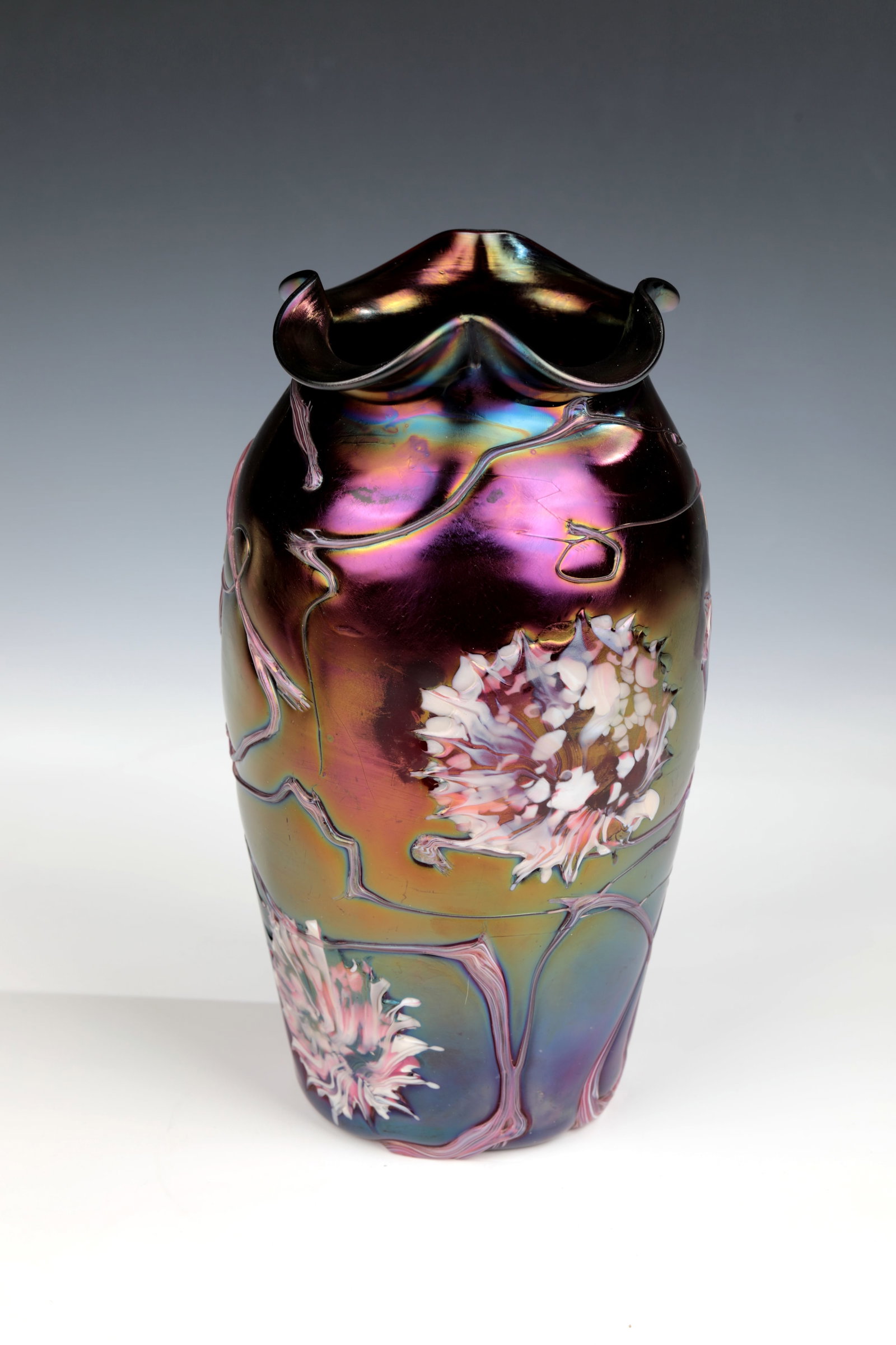 Vase: Elisabethenhütte vase, Pallme-König & Habel, c. 1900 Colourless, dark violet overlaid glass with polychrome, irregularly melted thread overlay and flowers. Quadruple lobed muzzle rim.