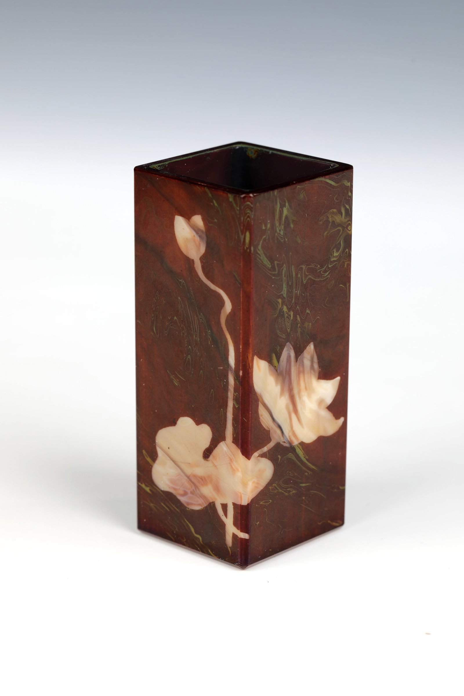 Square vase: Square vase Josef Riedel, Polaun, c. 1900 Beige-coloured, faceted cut opal glass with brown and green opaque glass marbled. Decor cut all around: flower, buds and foliage of the water lily. Engraved