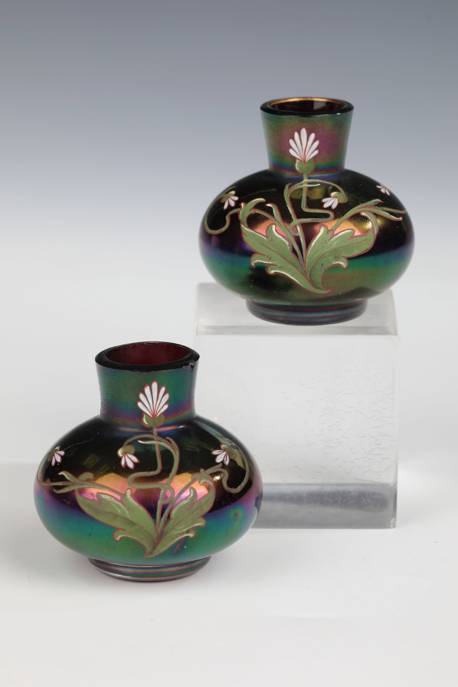 Pair of miniature vases: Pair of miniature vases Gräflich Harrachsche Glasfabrik, Neuwelt, c. 1900 Colourless glass, inside ruby red underlay. Colourful opaque enamel décor: flowering perennials. Matt iridescent. H.