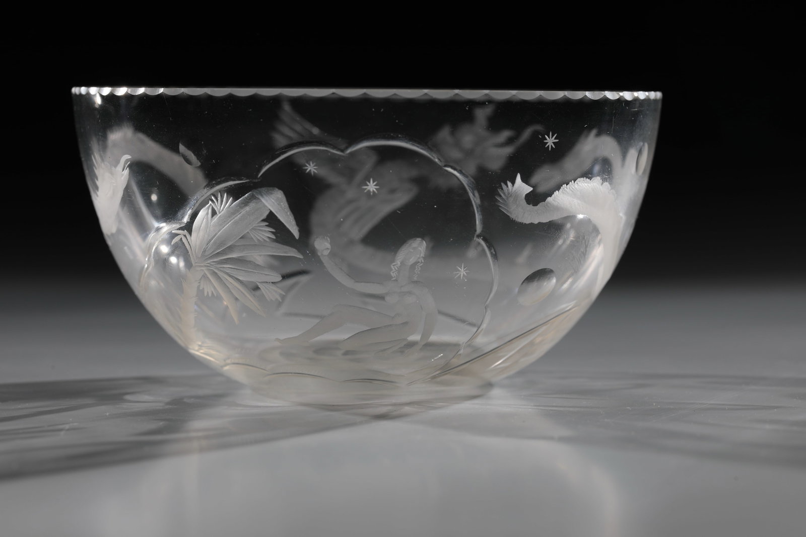 Small bowl: Small bowl attributed to Nora Ortlieb (design and execution), KGS Stuttgart, c. 1950 Colourless glass. All around with partly polished, finely executed surreal low-cut decoration. Unsigned. H. 6 cm.