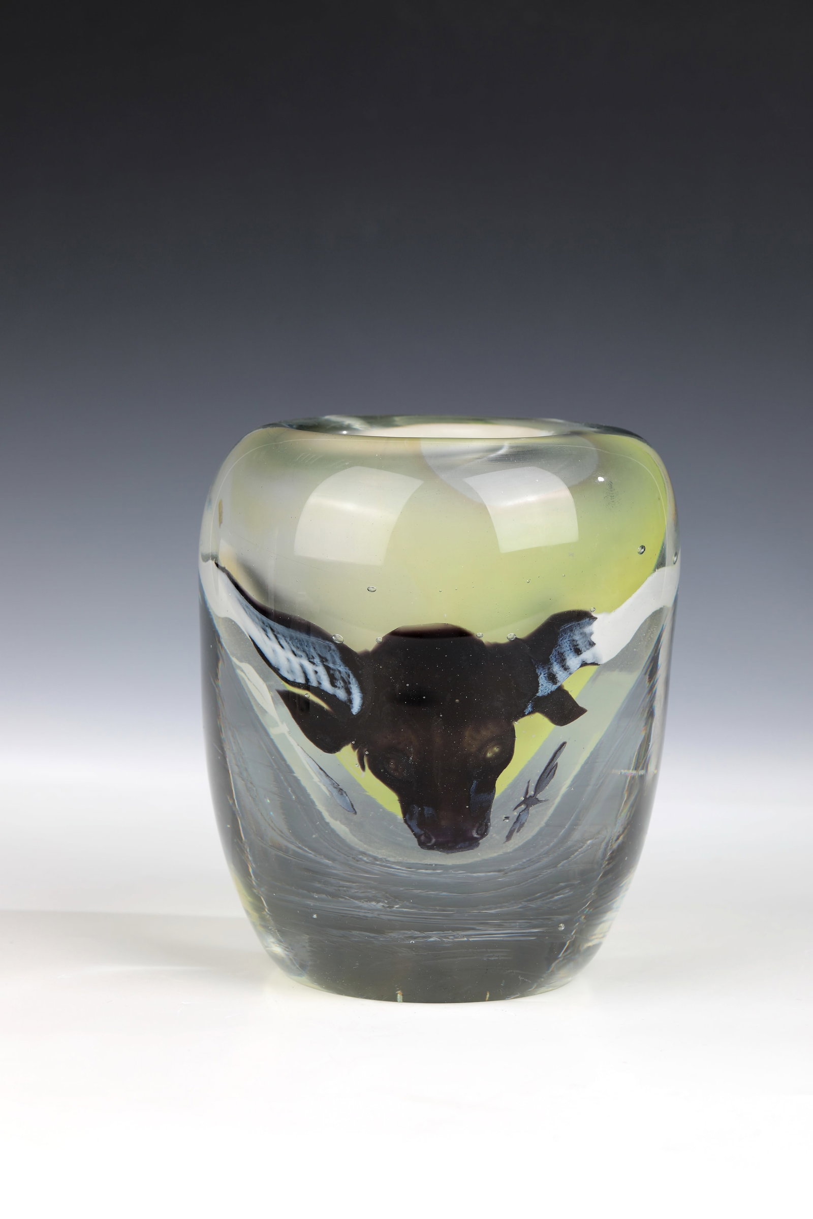 Vase with bull's head: Vase with Bull's Head Stanislav Borowski, 1988 Colourless, thick-walled glass with a thin light yellow underlay. Multi-coloured interlayer décor, decorated in cold technique after intermediate