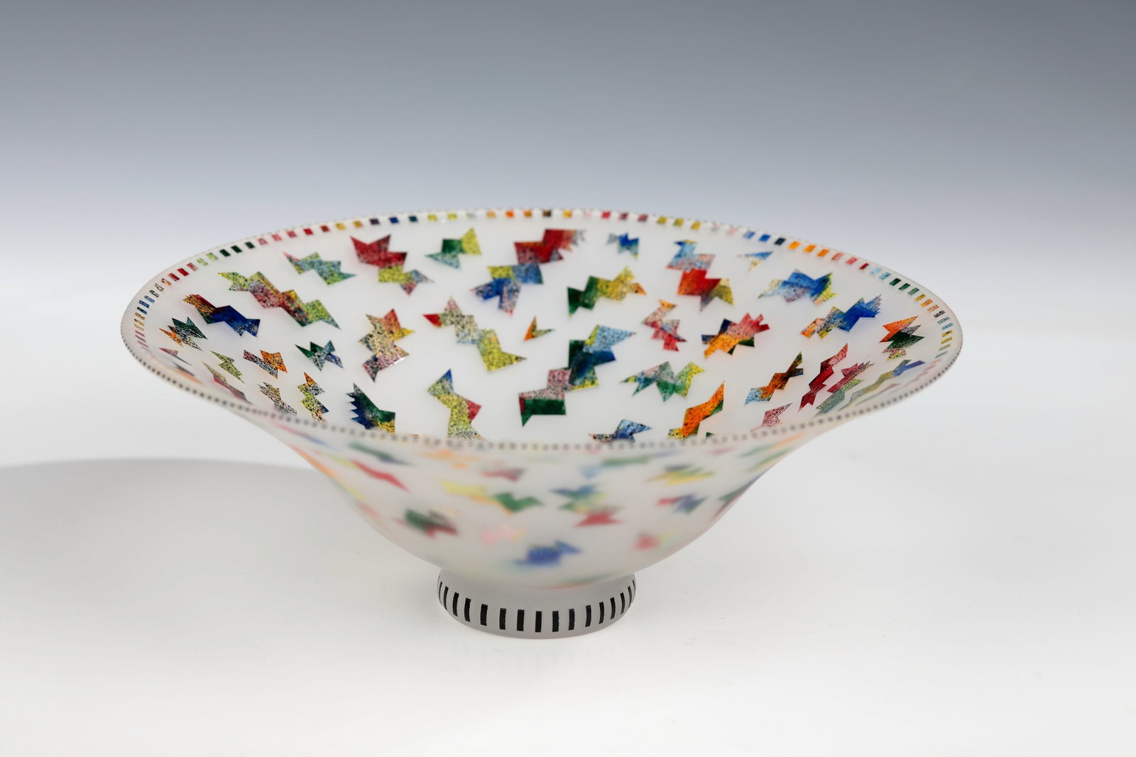 Shell: Bowl Freia Schulze, around 1980 Colourless glass with multicoloured melting, sandblasted. Monogrammed in engraving on the bottom: FS. H. 6.3 cm; D. 17 cm.