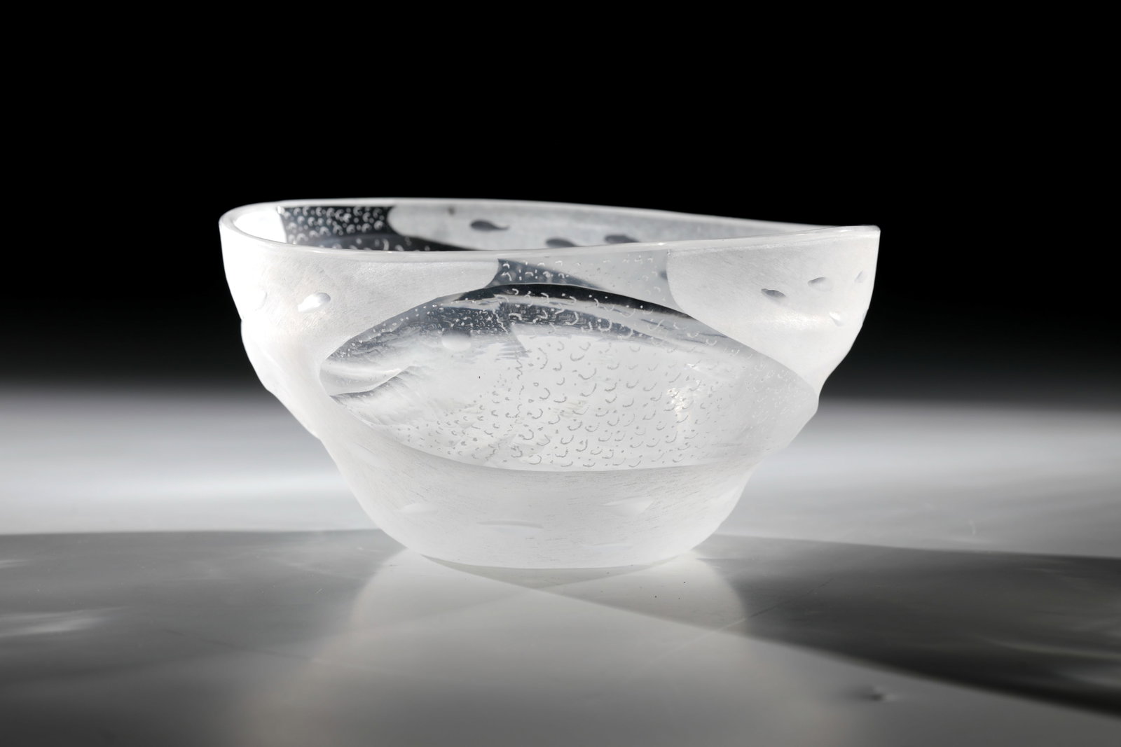 Shell: Bowl Hanns Model, 1977 Colourless glass, with rough matt and partly polished carved structures, wedge cut and vibro engraving. Monogrammed and dated in vibro-engraving: HM 1977, H. 9.5 cm; D. 18.5 cm.