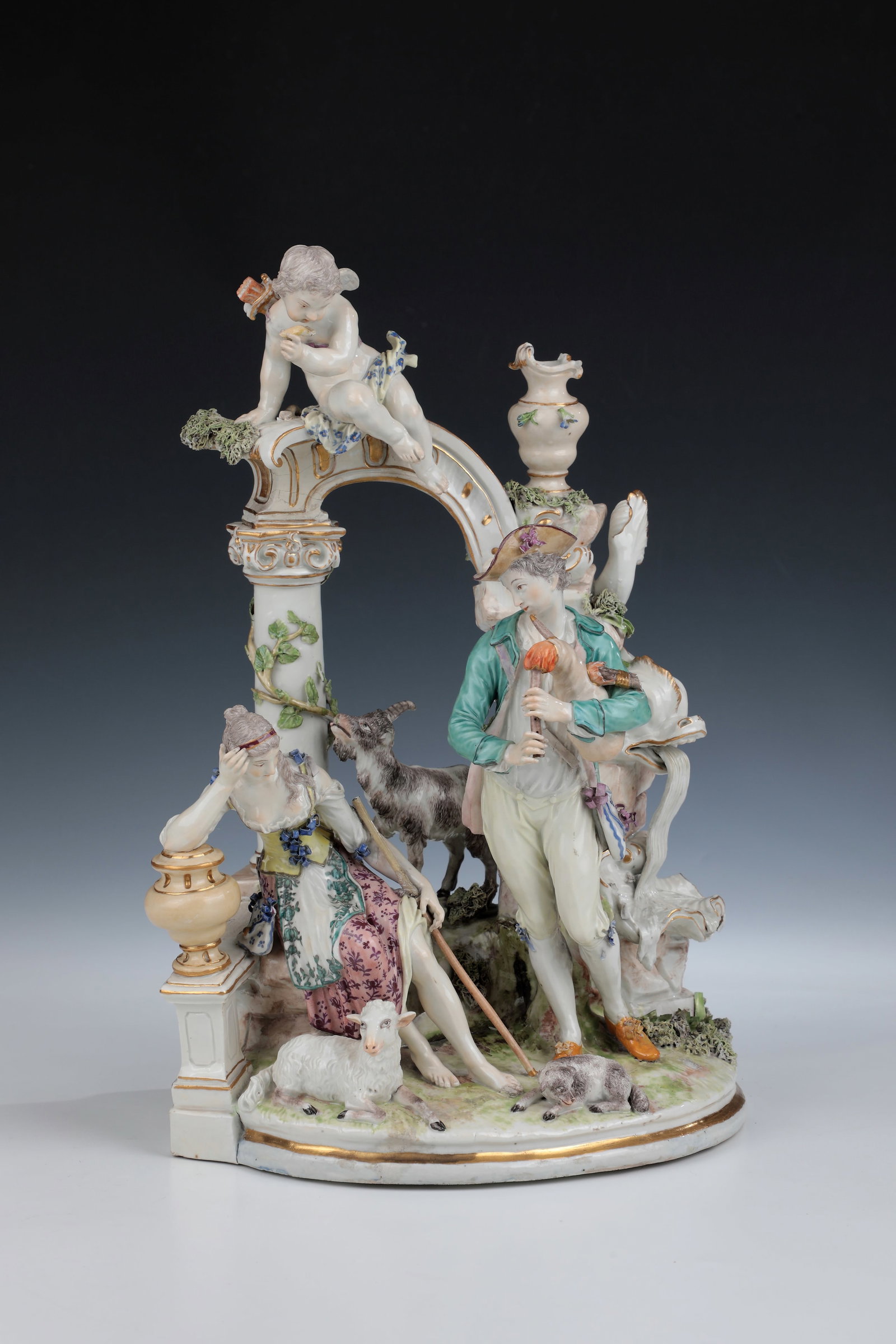 Large group of shepherds: Large group of shepherds designed by Johann Christian F.W. Beyer around 1762, Ludwigsburg around 1770 Below an arch of ruins, a scene of a sitting shepherdess watching Cupid looking downwards,