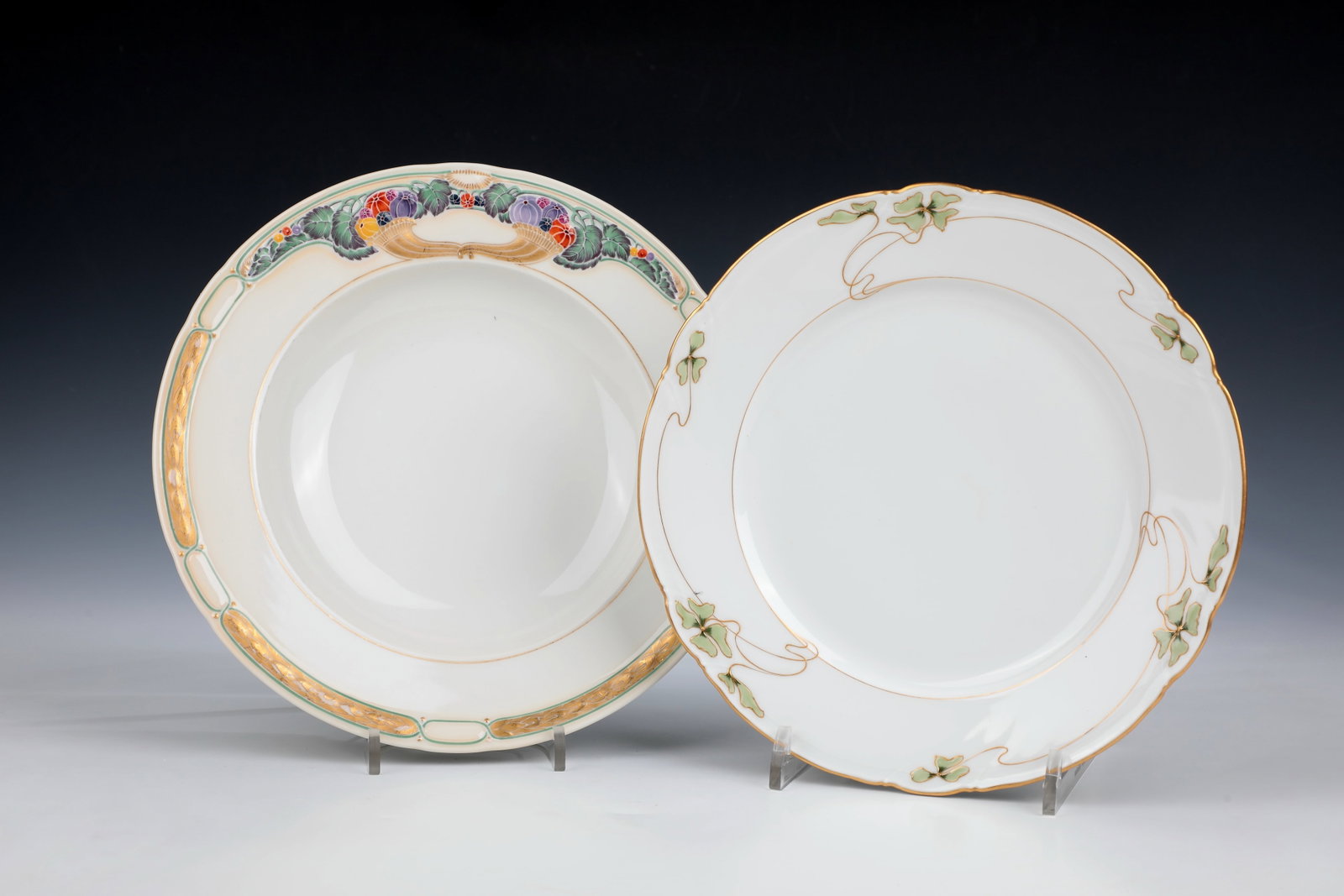 Two plates: Two plates KPM Berlin, early 20th century. Plate model ''Ceres'' with bay leaves, cornucopias and leaf tendrils, designed by Theodor Schmuz-Baudiss 1912. D. 25cm. Plate from the ''ribbon bow shape''
