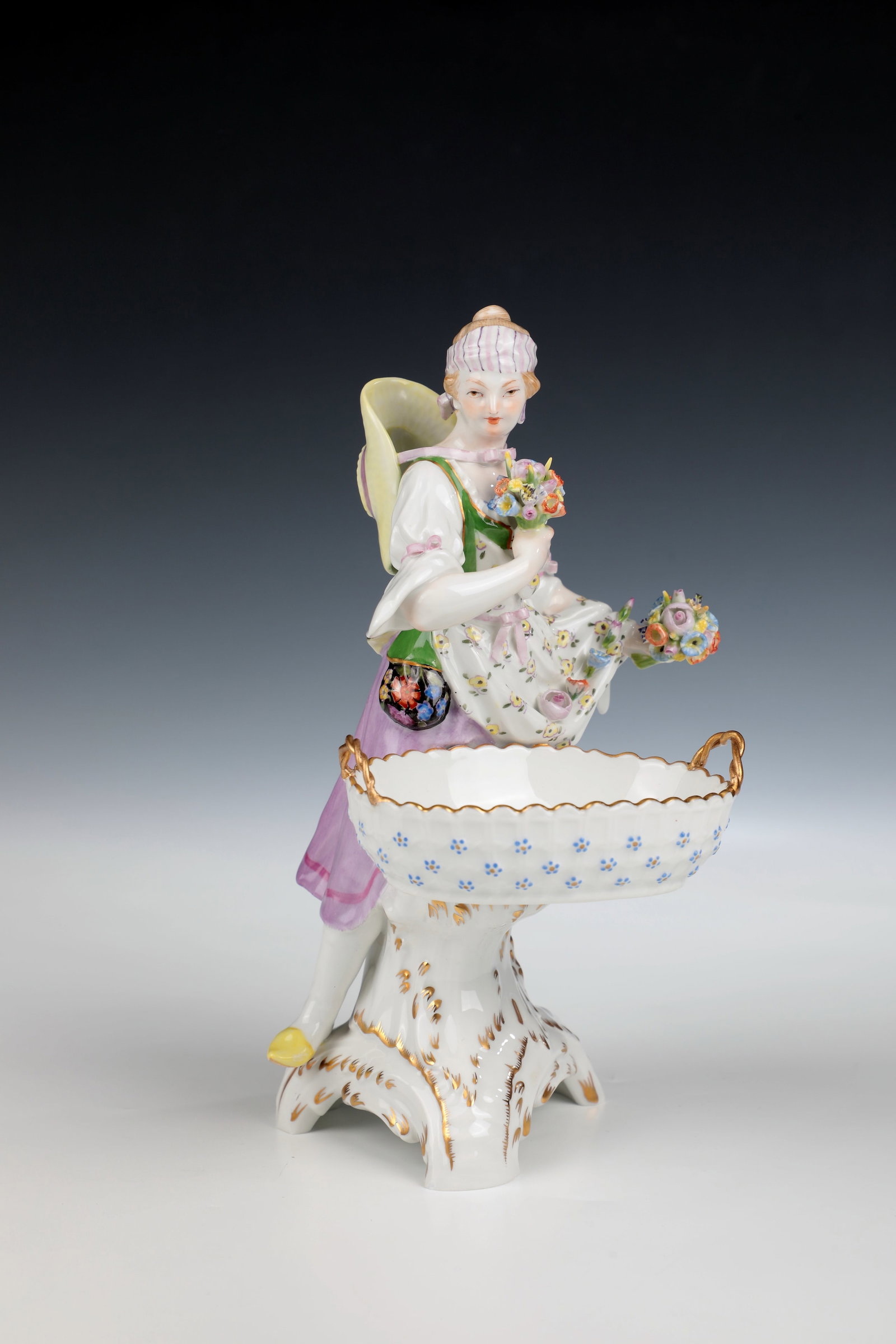 Porcelain figurine ''Spring'': Porcelain figurine ''Spring'' KPM Berlin, 1901 Standing girl with dress and apron, bouquets of flowers in both hands and a basket bowl in front of her. Fine painting, high-quality incarnate, rich