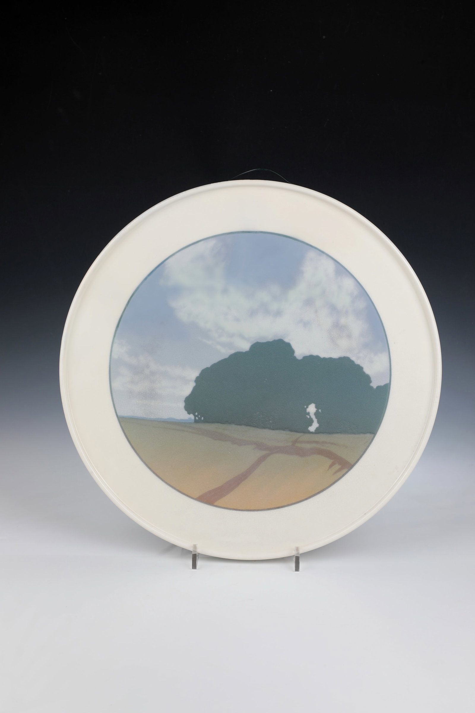 Large wall plate: Large Wall Plate KPM Berlin 1914-18 In the Mirror Meadow Landscape with Forest Belt and Slightly Cloudy Sky in Polychrome Painting. Sceptre mark with war mark. Restored fracture. D. 40cm.