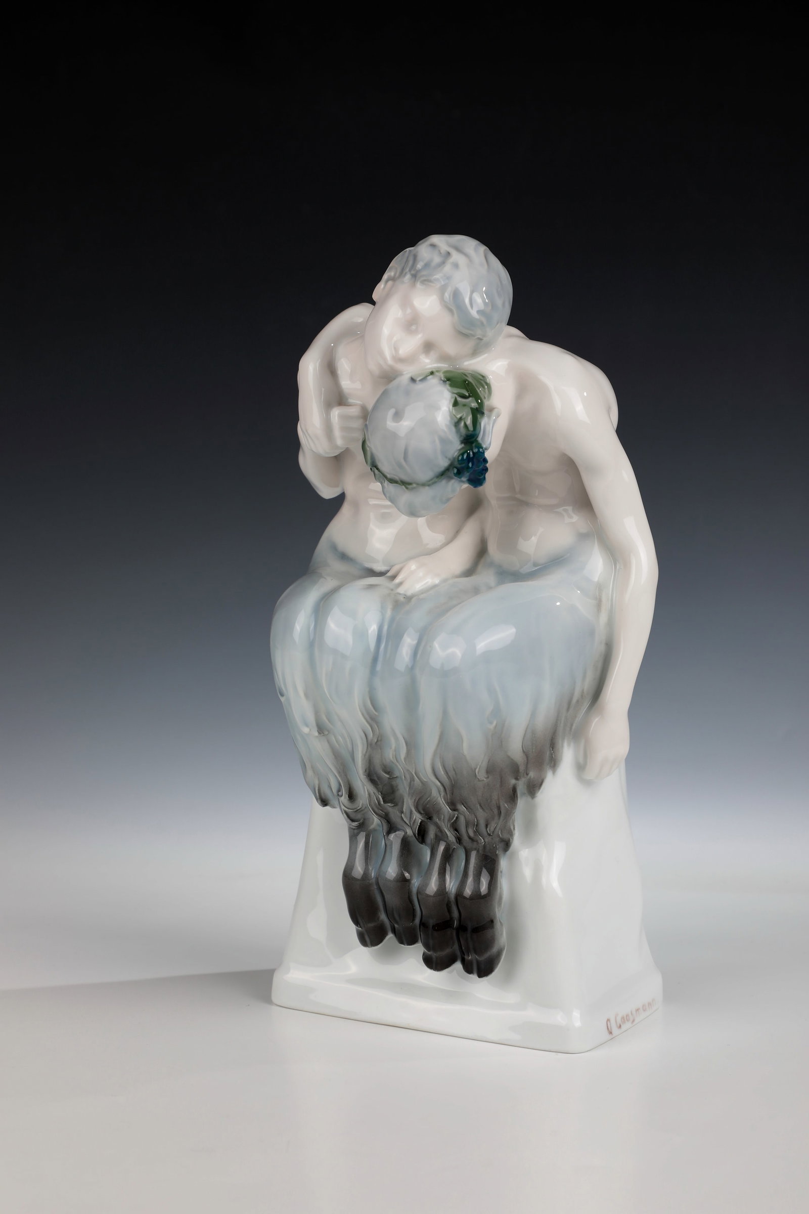 Sleeping Fauns: Sleeping Fauns designed by Albert Caasmann 1912, Rosenthal 1914 Sleeping fauns sitting on a stone pedestal in a discreet underglaze painting. Artist signature and green stamp mark. H. 24.5cm. Cf.