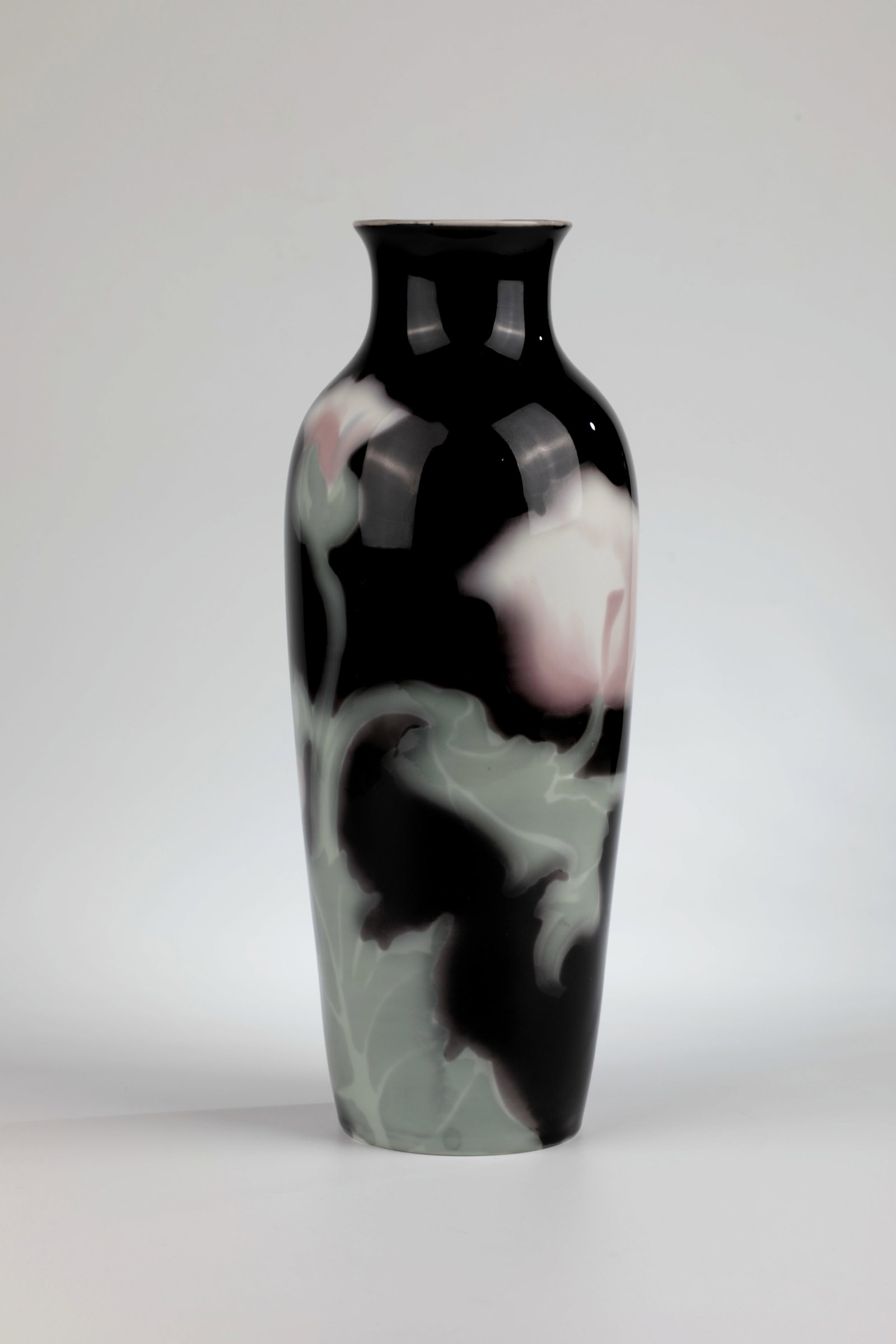 Vase with opium poppy décor: Vase with opium poppy décor Rörstrand ́s Porslinsfabriker AB, Stockholm around 1900 Porcelain, white with pastel-coloured underglaze on a black background. Reference: Manufacture mark,