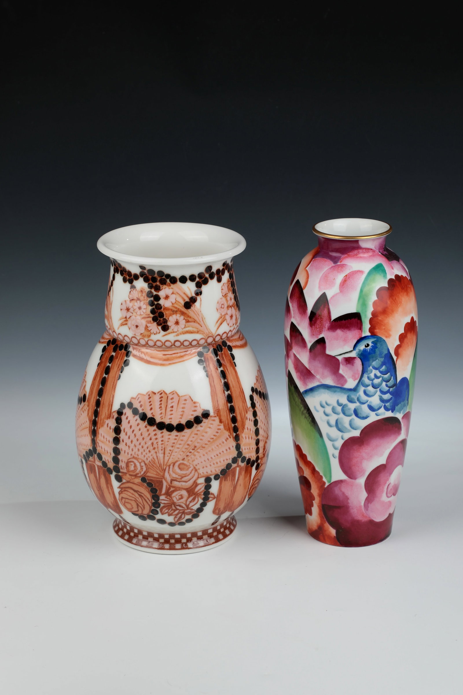 Two vases: Two vases designed by Jean Beaumont and Guy Loe, Sèvres around 1935/36 Vase ''Louet'', décor after Guy Loe, 1936. In shades of red and brown. Manufactory and painter's mark, CP d'ap. Guy