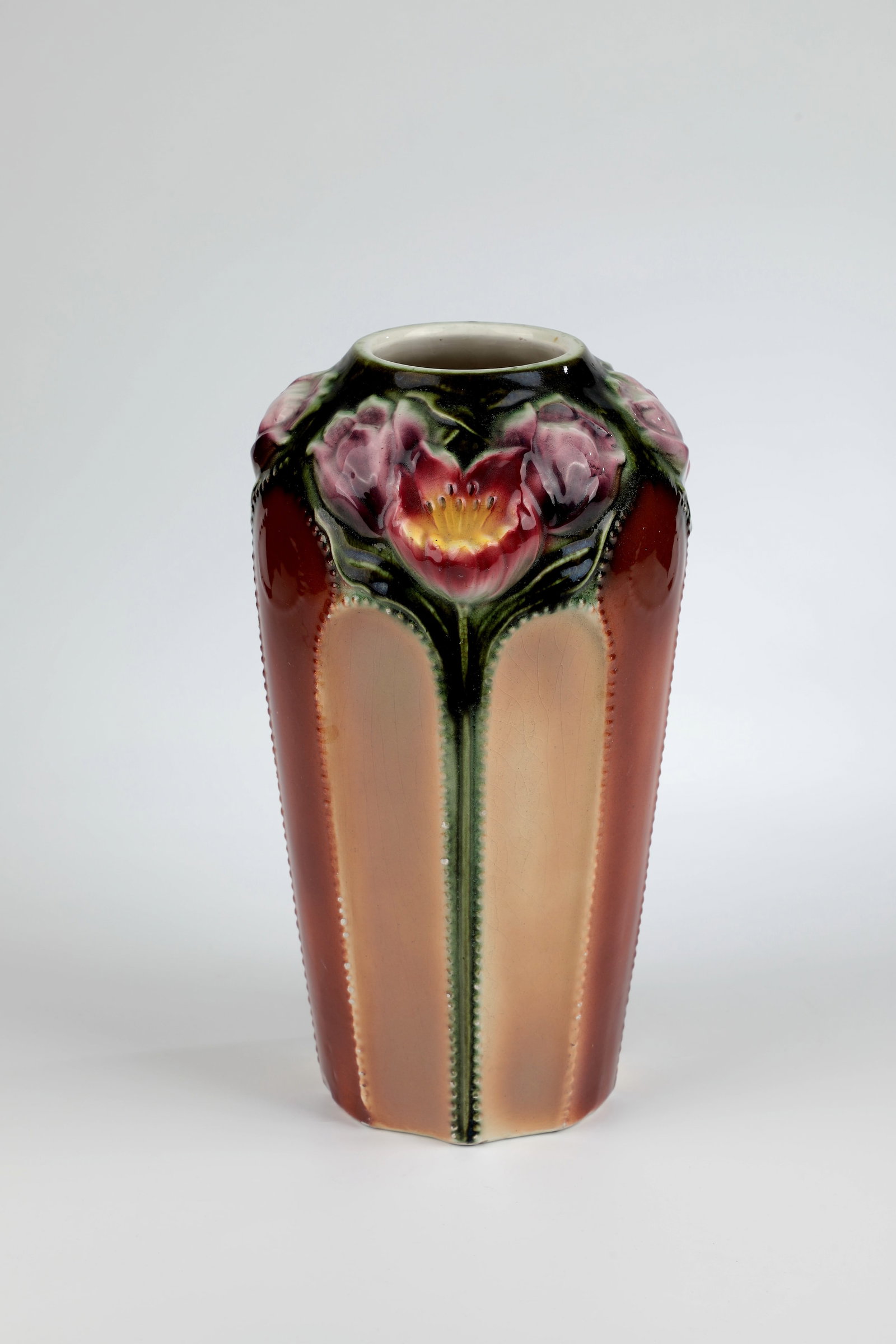 Vase: Vase Circa 1900 Ceramic vase in shades of brown with polychrome flowers in high relief. Several small shots. H. 29 cm.
