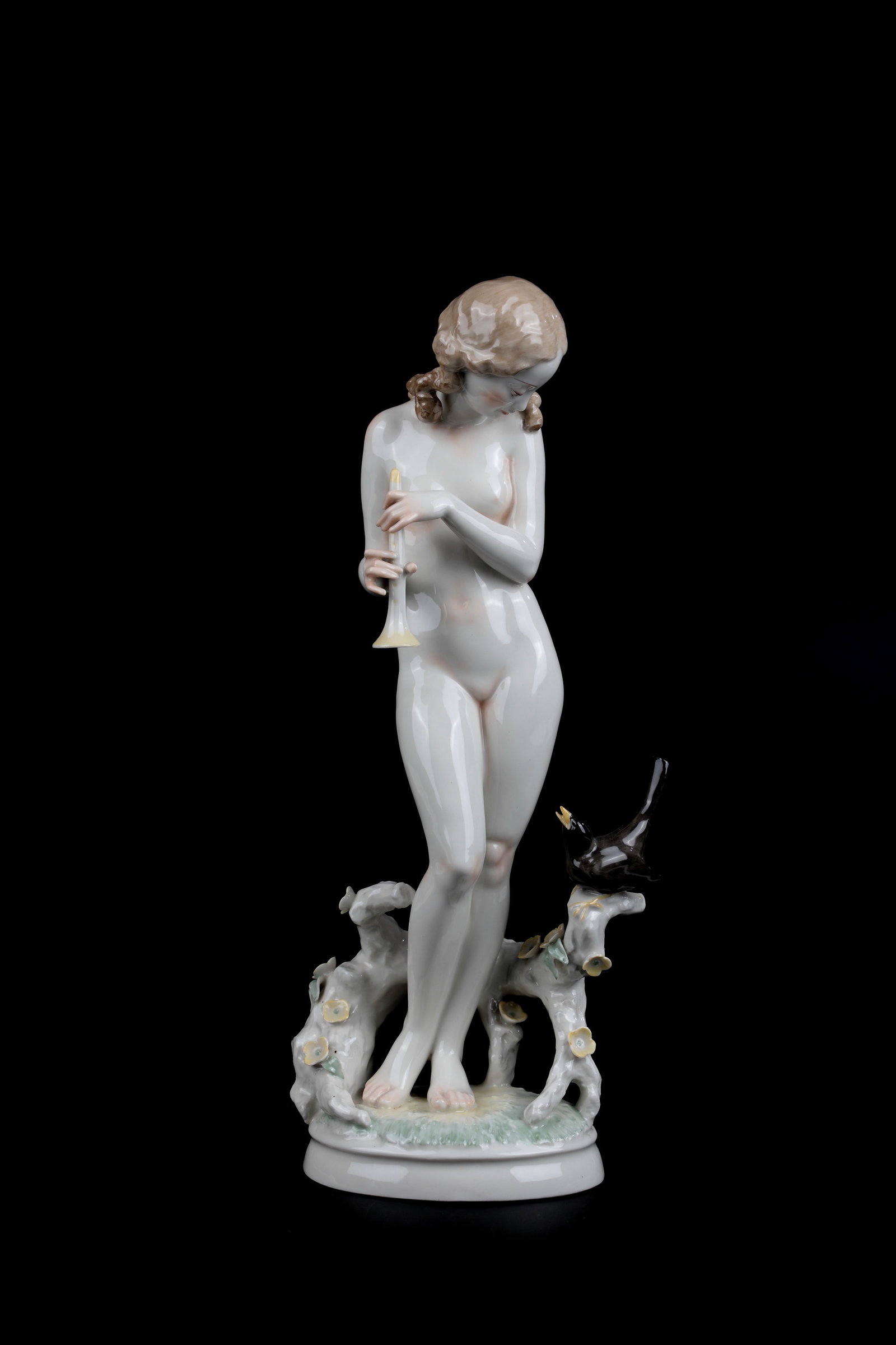 Flute Lessons: Flute lessons Hutschenreuther, art department Selb, Carl Werner (design) around 1950 Porcelain with polychrome glass painting. On an oval landscape pedestal, the young woman stands in front of a