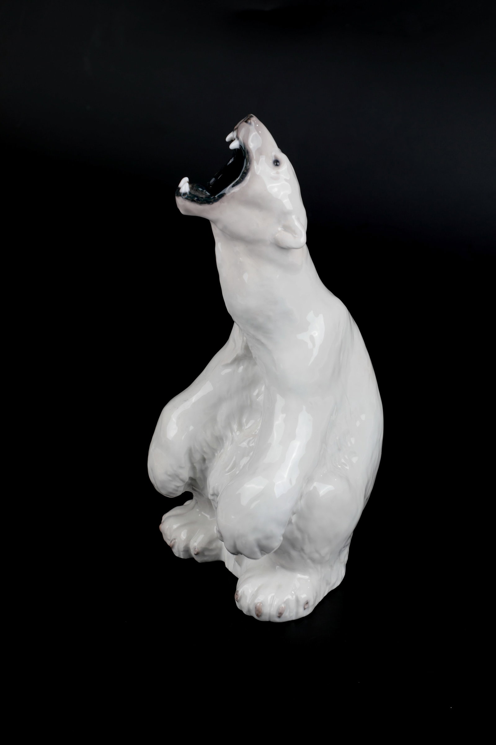 ''Roaring Polar Bear'': ''Roaring Polar Bear'' designed by Carl Frederik Liisberg 1894, Royal Copenhagen before 1922 Sparse, naturalistic underglaze painting. Bottom with manufactory and shaft mark. H. 32.3 cm.