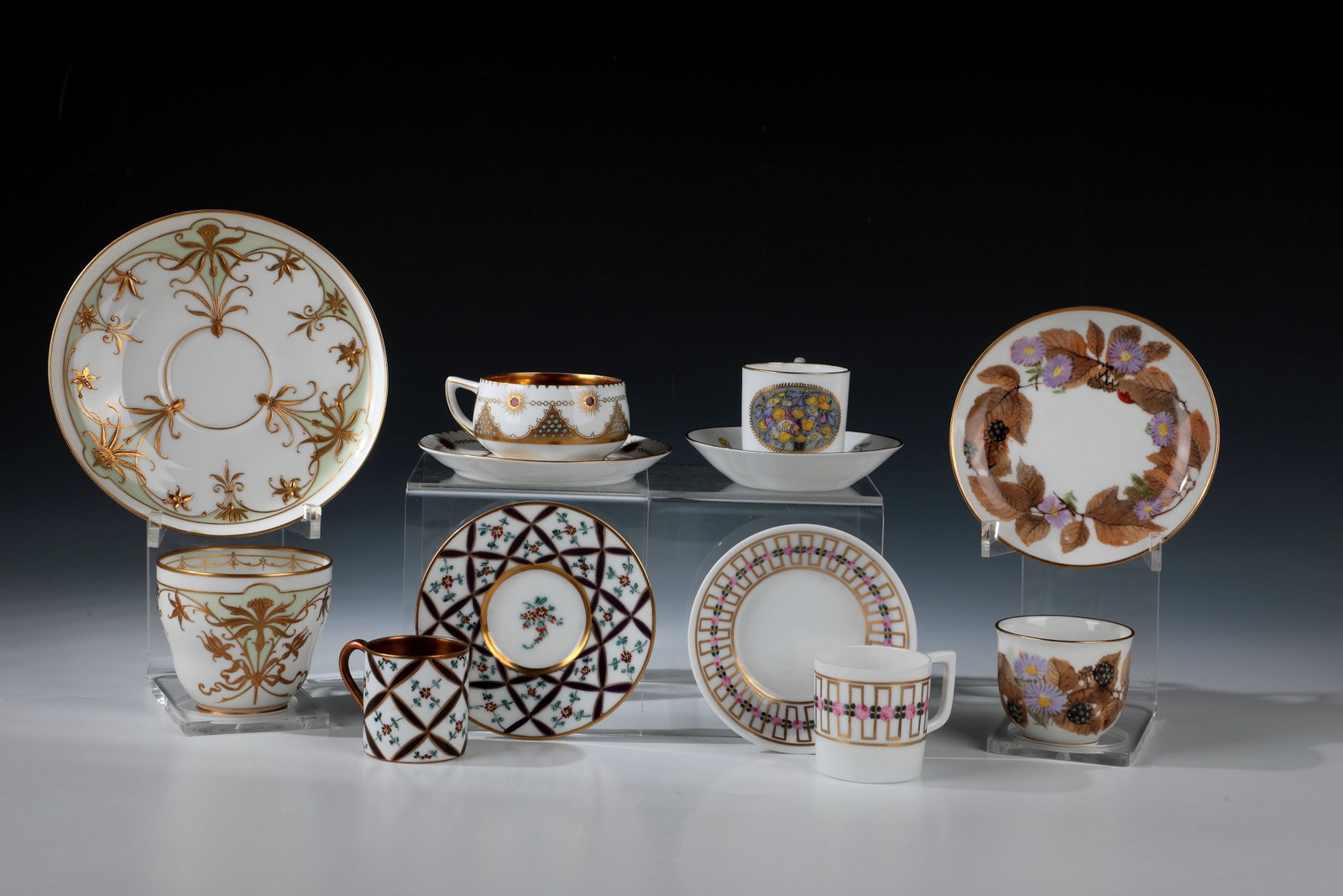 Six mocha cups with saucers: Six mocha cups with saucers, including Nymphenburg, early 20th century Three cups Nymphenburg, two of them design by Adelbert Niemeyer, décor designs probably by Rudolf Sieck. A cup of