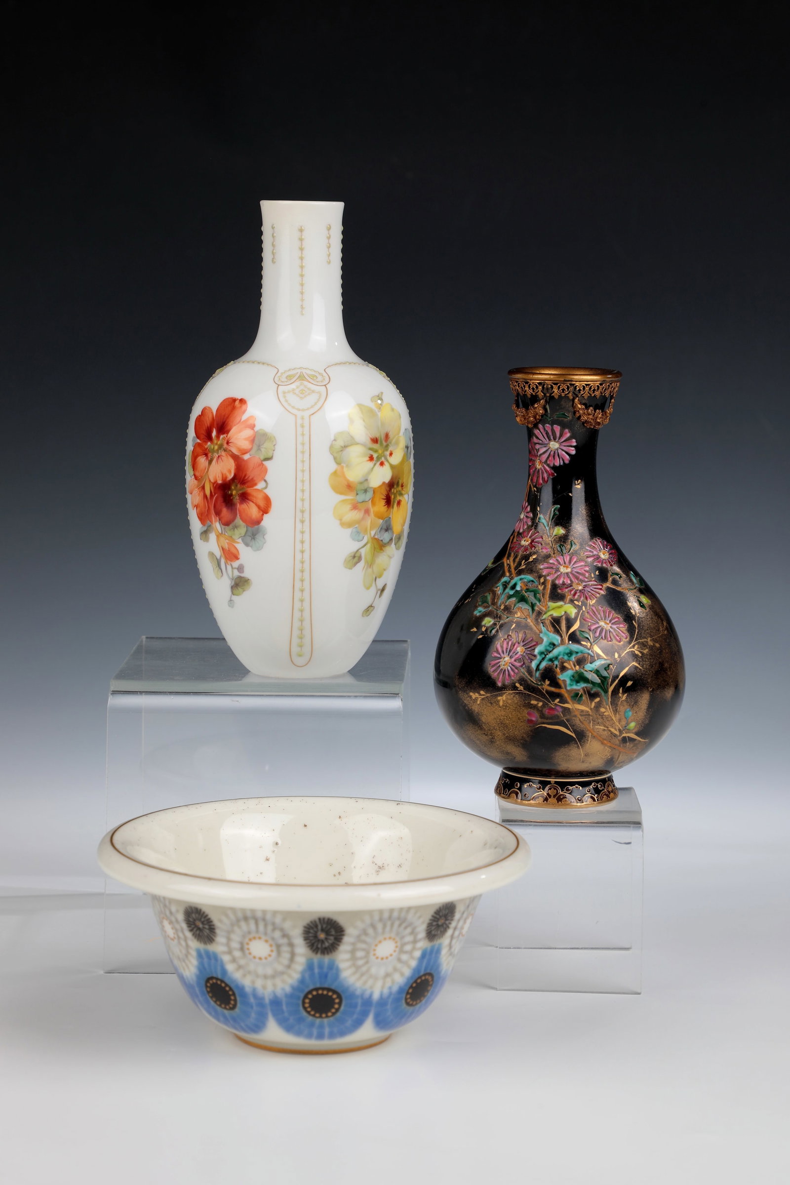 Two vases and a small bowl: Two vases and a small bowl Sèvres and KPM Berlin Small vase, Sèvres, 1882. With black overglaze painting and polychrome enamel decoration with flowers and gold. Muzzle rim with gilded mount 