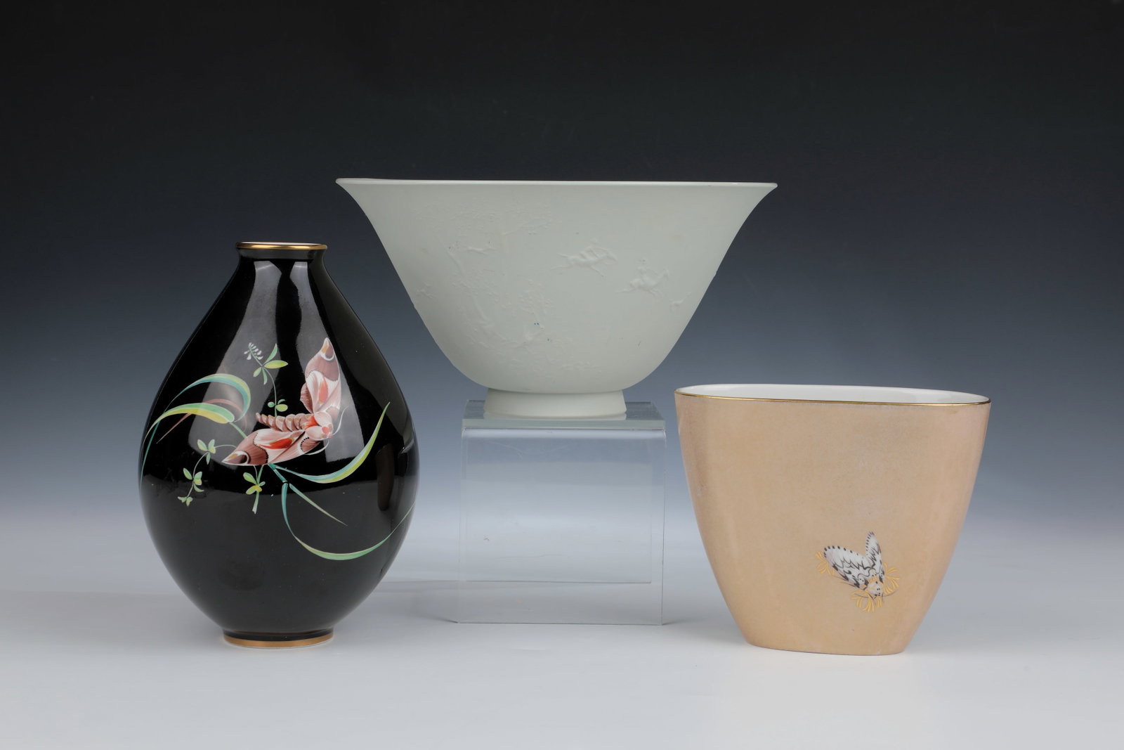 One vase and two bowls: One vase and two bowls KPM Berlin, mid-20th century. Vase with decoration ''Moth'', designed by Liselotte Lüpke 1939 (form) and Sigrid v. Unruh 1954 (décor). h. 19 cm. Flower bowl with a sma