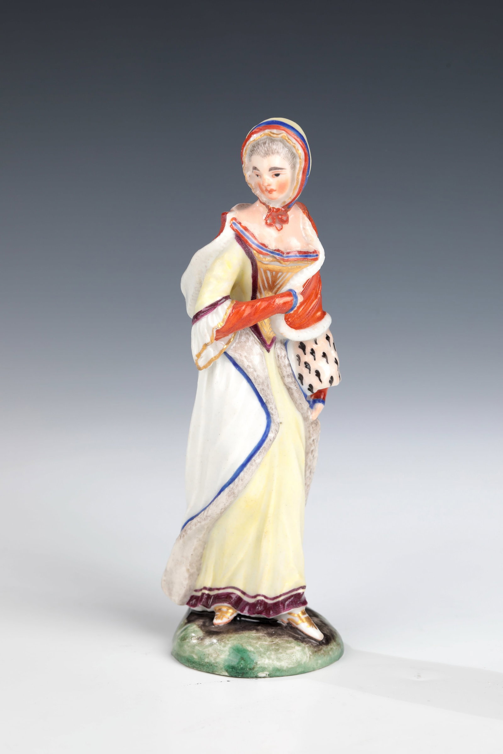 Lady with a muff: Lady with Muff Model by Joseph Nees, Ludwigsburg around 1765 In polychrome painting on a natural pedestal, elegantly dressed lady in period costume with muff on her left arm. Underglaze blue CC