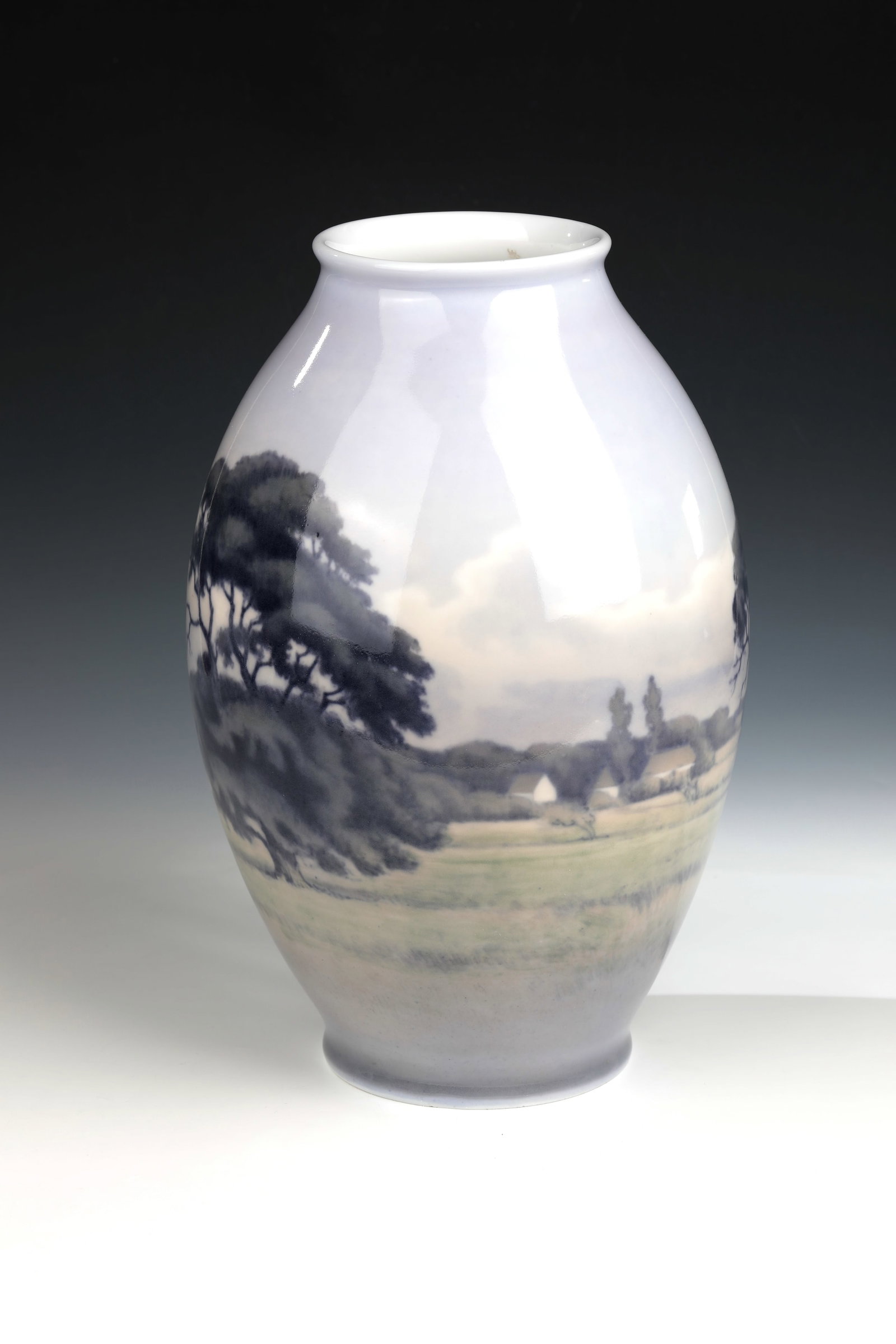 Large Vase: Large vase designed by Niels Munk Plum, Royal Copenhagen, dated 1925 Porcelain with landscape decoration in fine underglaze painting, signed and dated on the bottom. H. 37cm.
