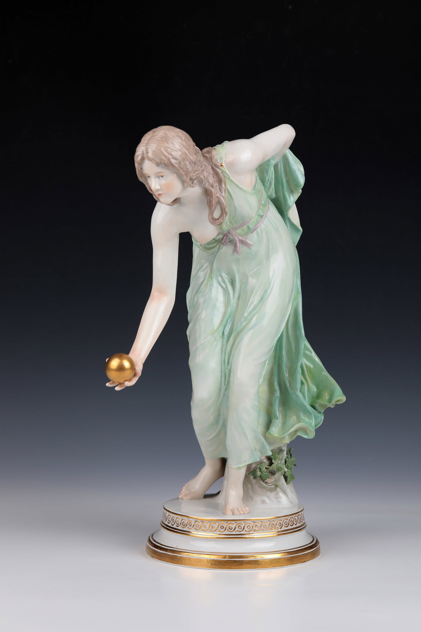 ''Ball player'': ''Kugelspielerin'' designed by Walter Schott around 1897, Meissen around 1910 On a gold-decorated round pedestal depicts a girl, scantily dressed, with a ball in her right hand. Sword mark, model
