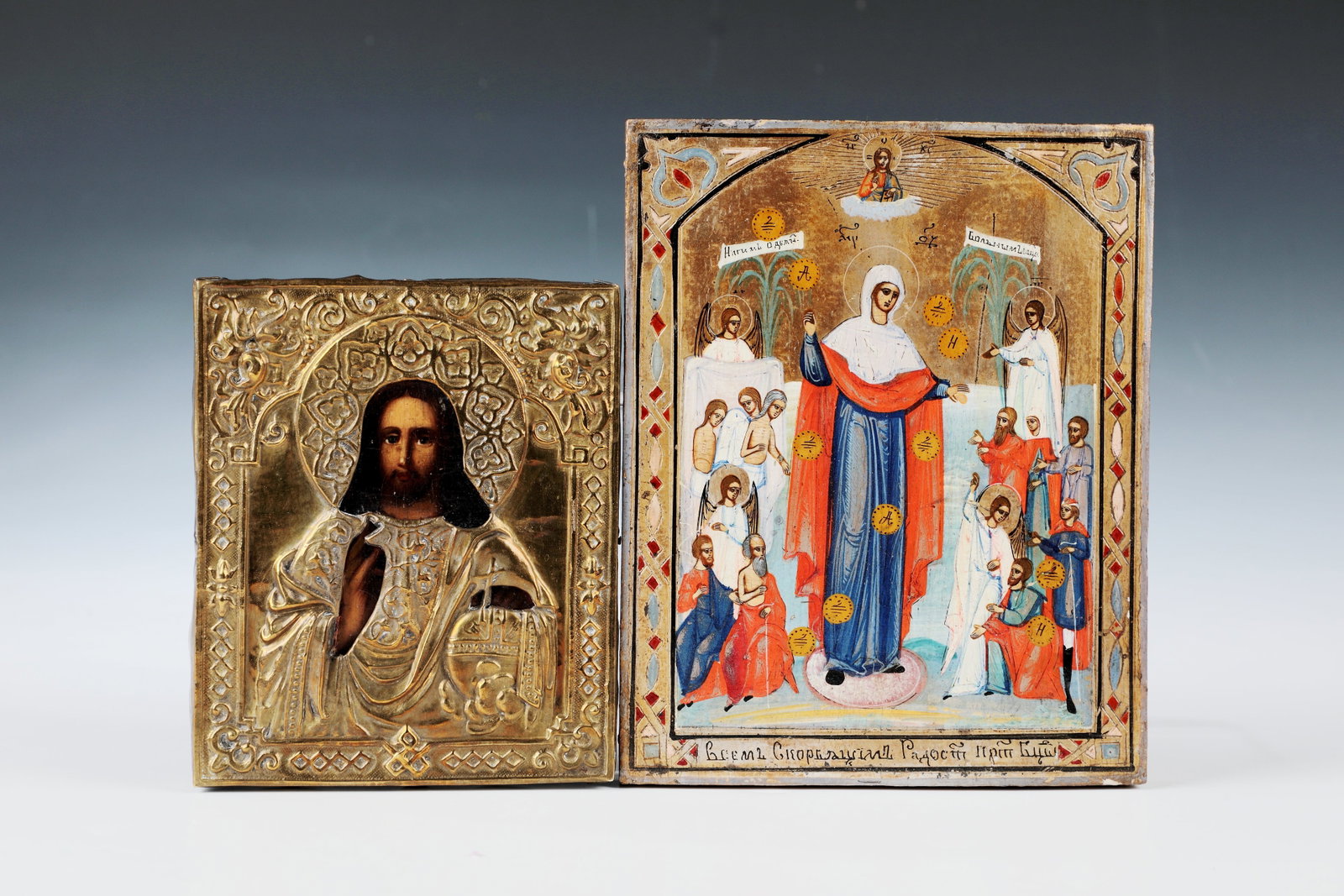 Two icons: Two icons of Russia, 19th century Mother of God "Joy of all the afflicted": tempera on wood with a gold background. The Blessed Mother in the midst of angels and those seeking help, above Christ in gl