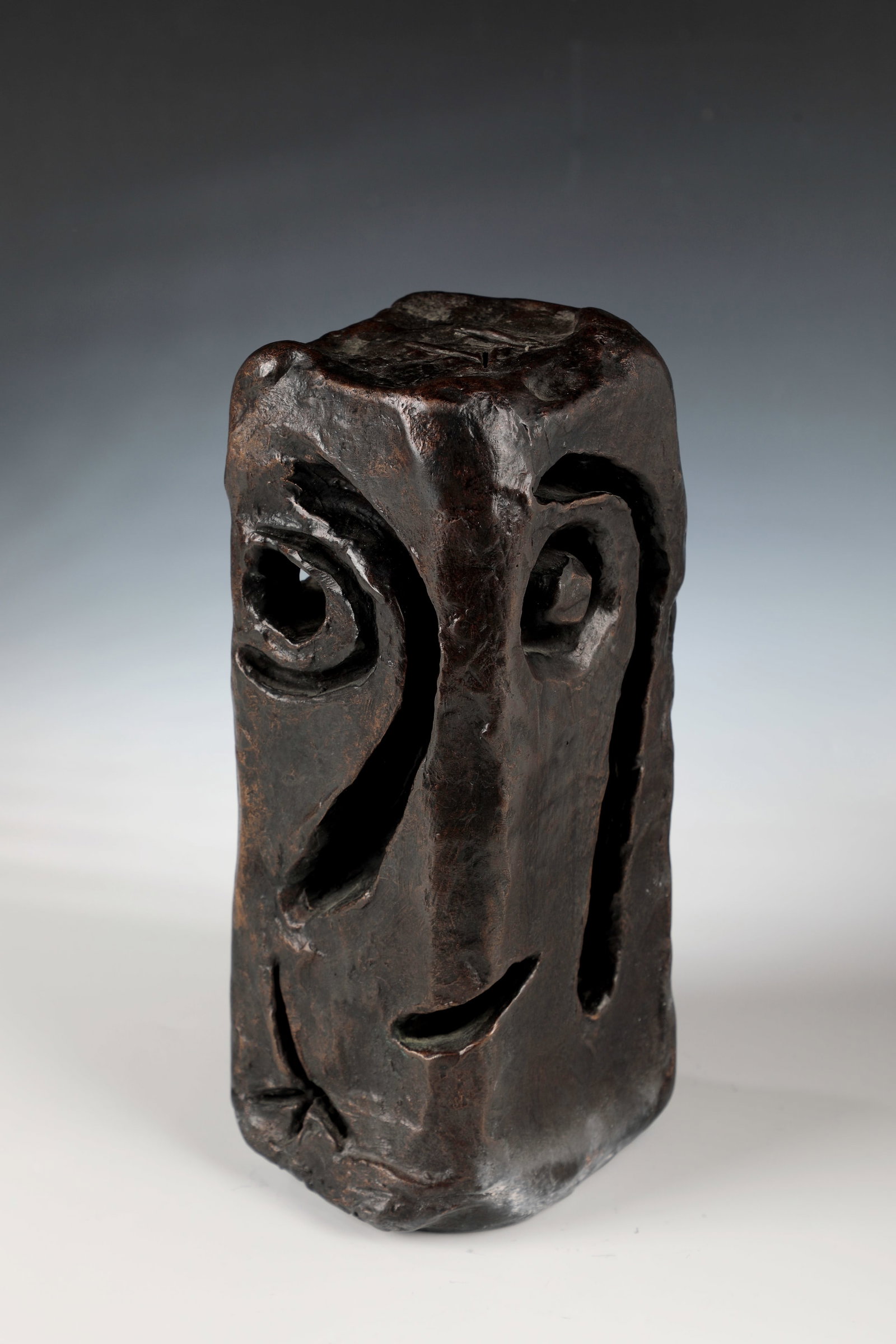 Two faces: Two Faces Michael Feicht (1959 Wessling) Bronze, dark brown patina. Cubic body with stylized face and openwork sections, the eyes designed as spiral depressions. Monogrammed on the top: MF (incised