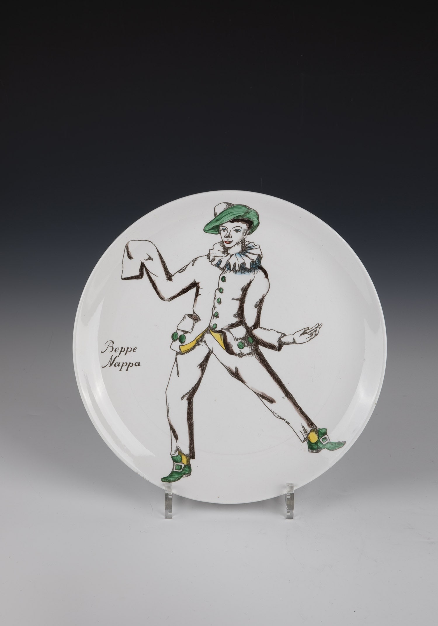 Plate ''Beppe Nappa'': Plate ''Beppe Nappa'' Piero Fornasetti, 1950s Dancing Sepp in black overglaze print and polychrome painting. On the back with the company brand and the name ''INDUSTRIA CERAMICA VICENTINA''. D. 26.5