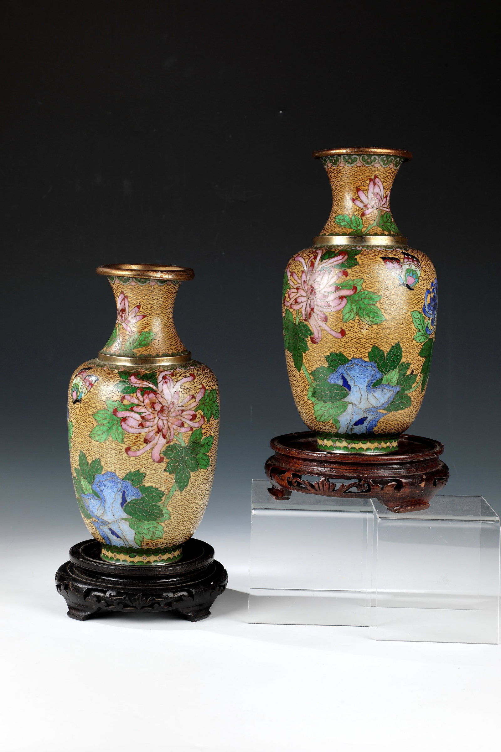 Pair of Cloisonné Vases: Pair of Cloisonné Vases China, Qing Dynasty, Late 19th/ Early 20th Century Pair of cloisonné enamel vases, baluster-shaped. Floral décor all around with butterflies, chrysanthemums and