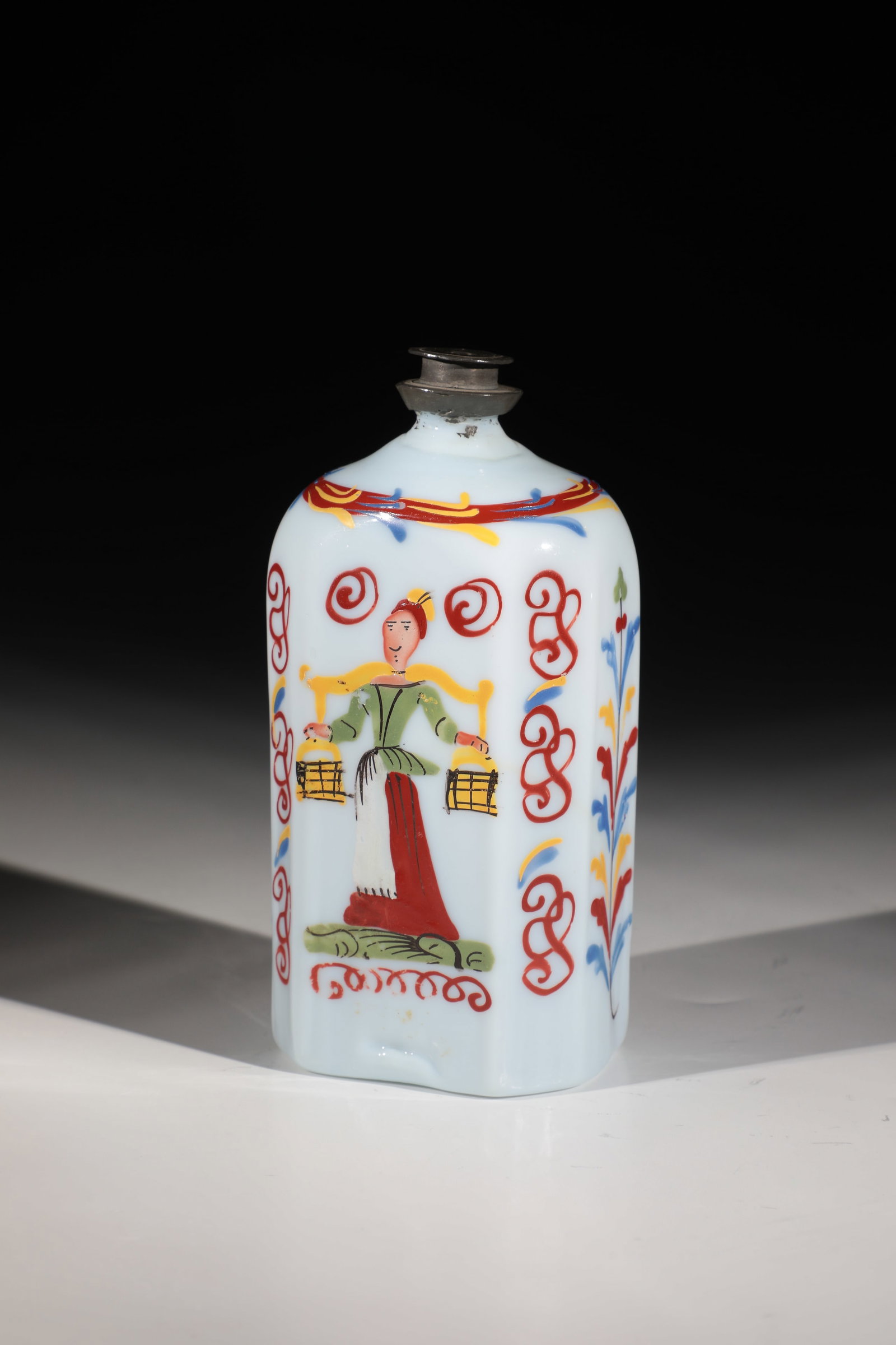 Liquor bottle: Schnapps bottle German, 18th century, frosted glass with tear-off. Rectangular wall with bevelled corners. Frontal in polychrome enamel painting depicting a water carrier. Stylized flower perennial
