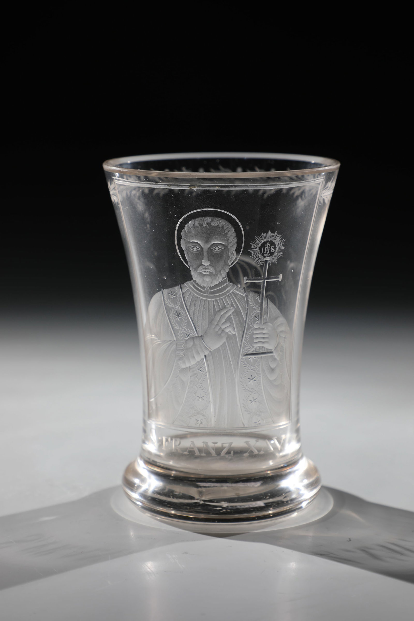 Mug Depiction of the Missionary S. Francis Xavier: Beaker Depiction of the missionary S. Francis Xavier E. 19th century Colourless glass. Frontal cut depiction inscribed: ''S. FRANZ XAV''. Monogram ''FB'' on the reverse. Below the lip edge leaf