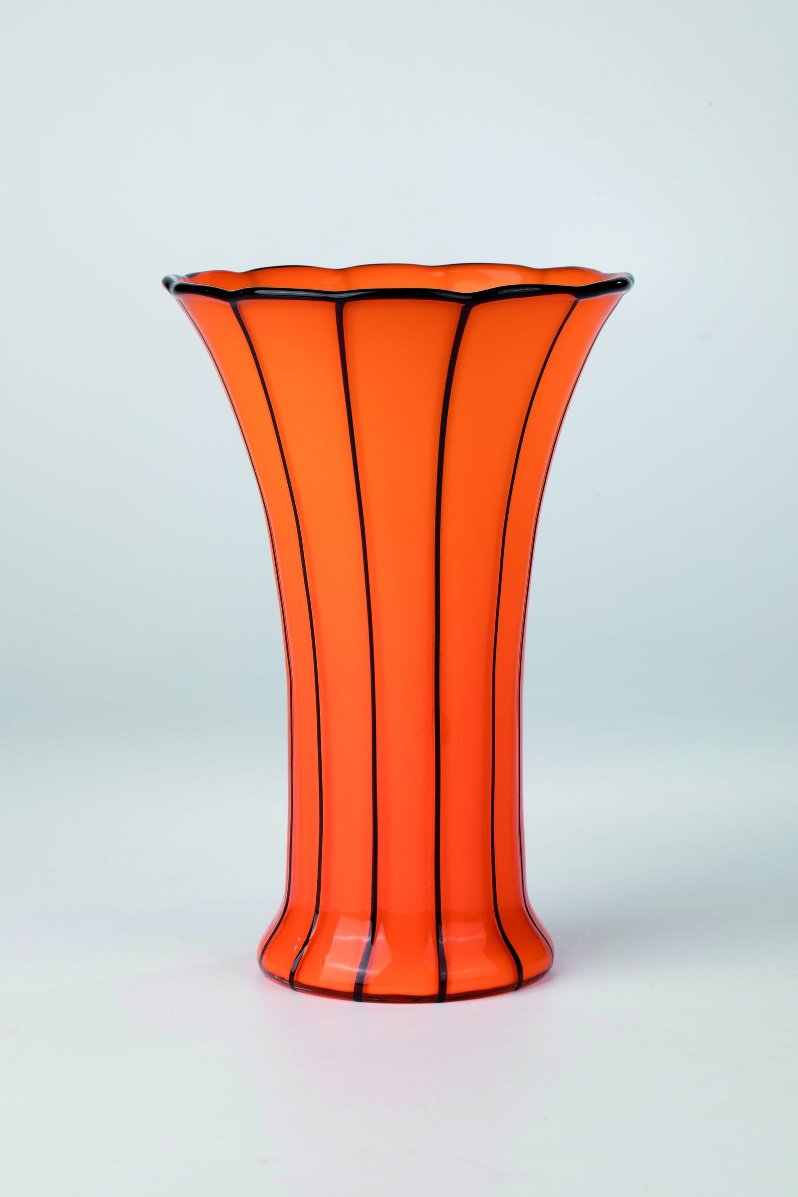 Vase ''Version 157, orangeopal with black'': Vase ''Version 157, orange opal with black'' Michael Powolny (shape design), Loetz Wwe., Klostermühle, 1914 Orange opal glass. The colourless top layer with vertically melted black-violet