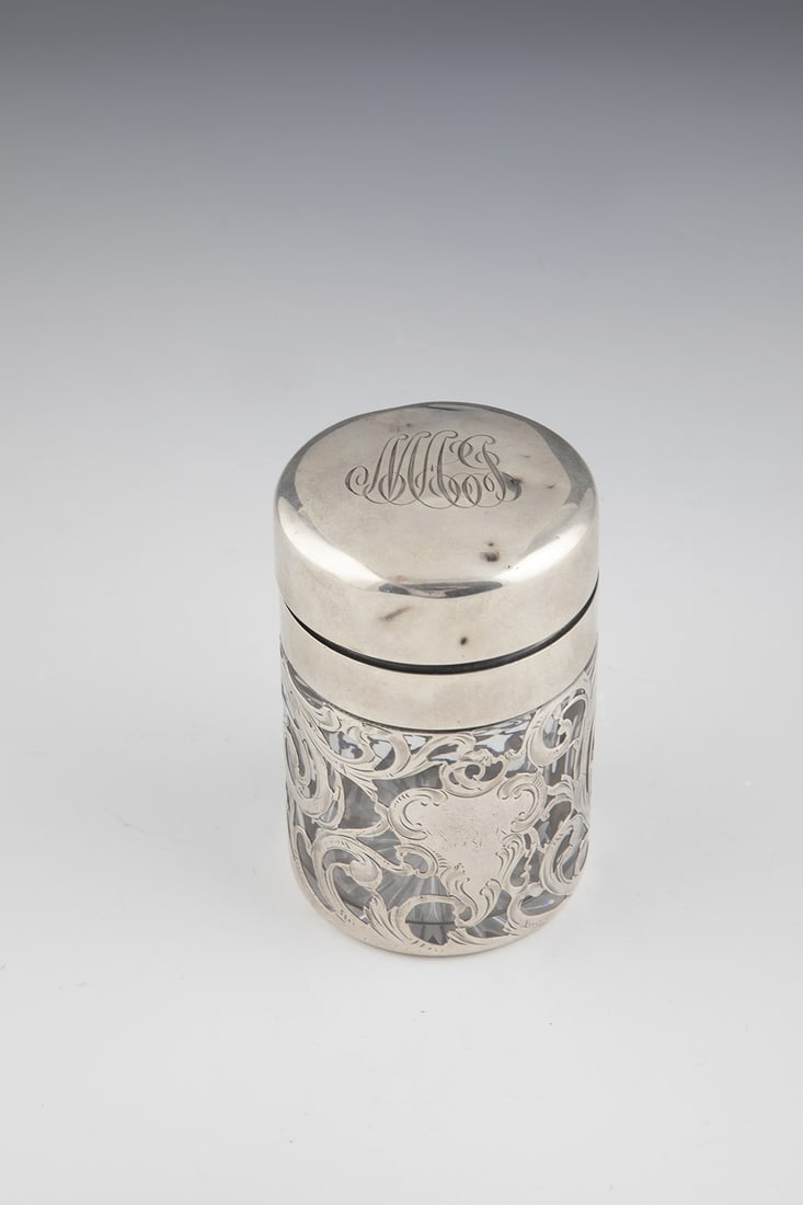 Bottle with galvanized fine silver decoration: Bottle with galvanized fine silver decoration Colorless glass with floral-worked glavanized fine silver decoration and inside gilded silver lid with the initials ''MHG'' silver stamped with