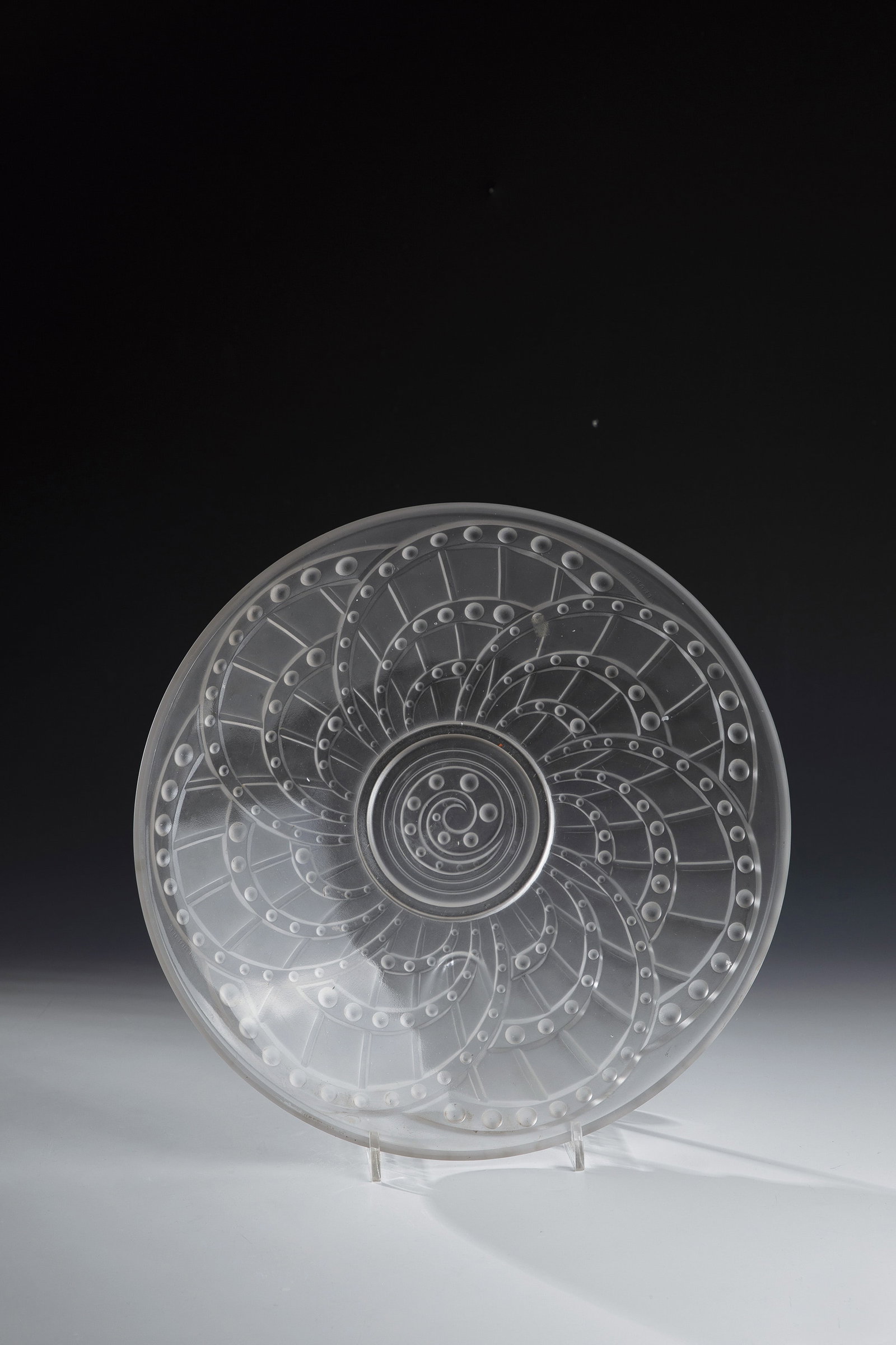 Large bowl: Large Bowl Jacques Landier, Sèvres, 1930s Colorless glass, pressed into the mold. On the underside, strongly reliefed decoration: stylized flower. Below the mouth of the mouth inscribed: