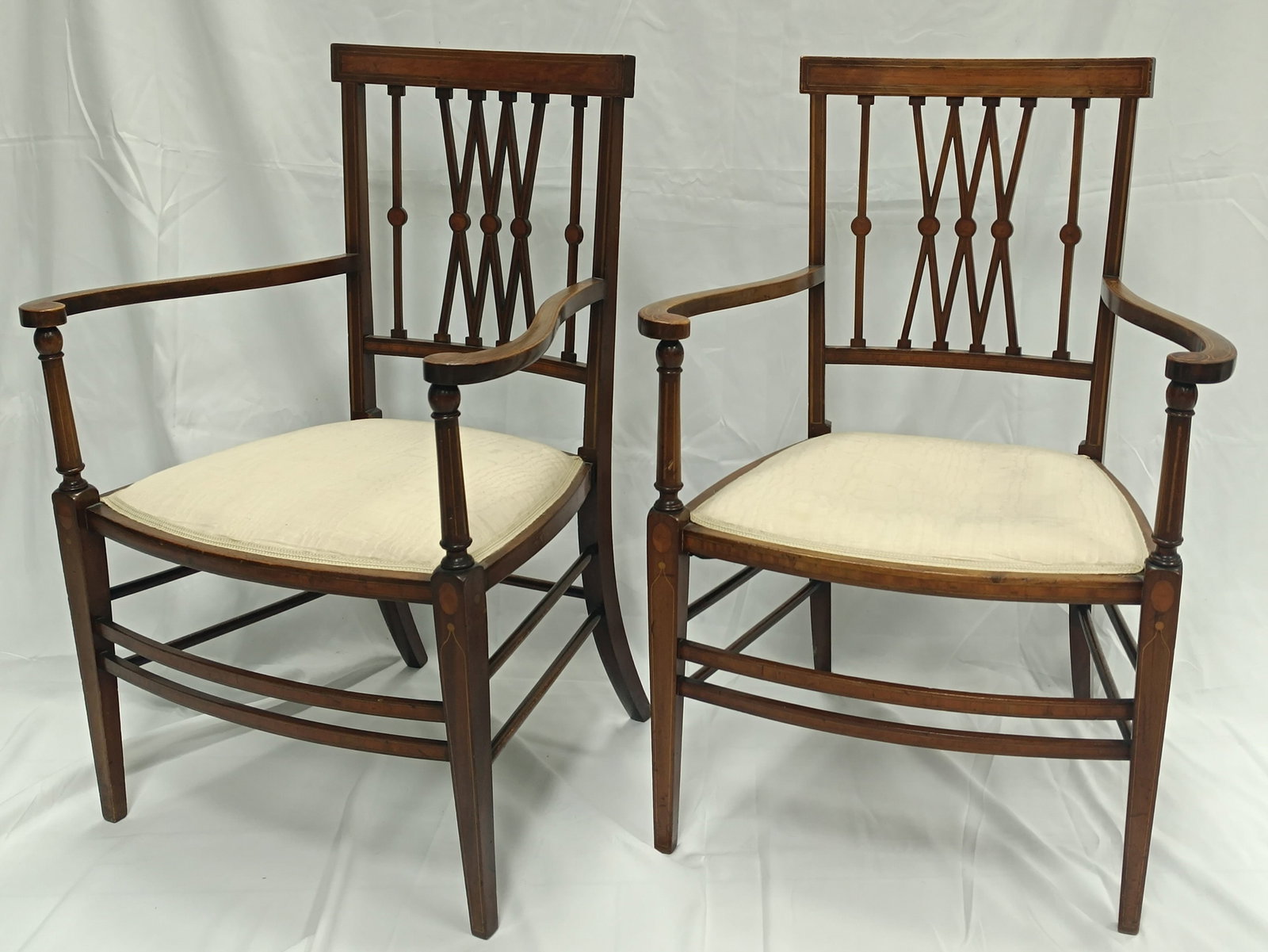 Pair of chairs: Pair of chairs late 19th century Probably oak, veneered and inlayed. On four legs, backrest pierced with bars. Seat upholstered afterwards. Traces of age and wear. H. 89 cm. Paar Stühle Ende 19.