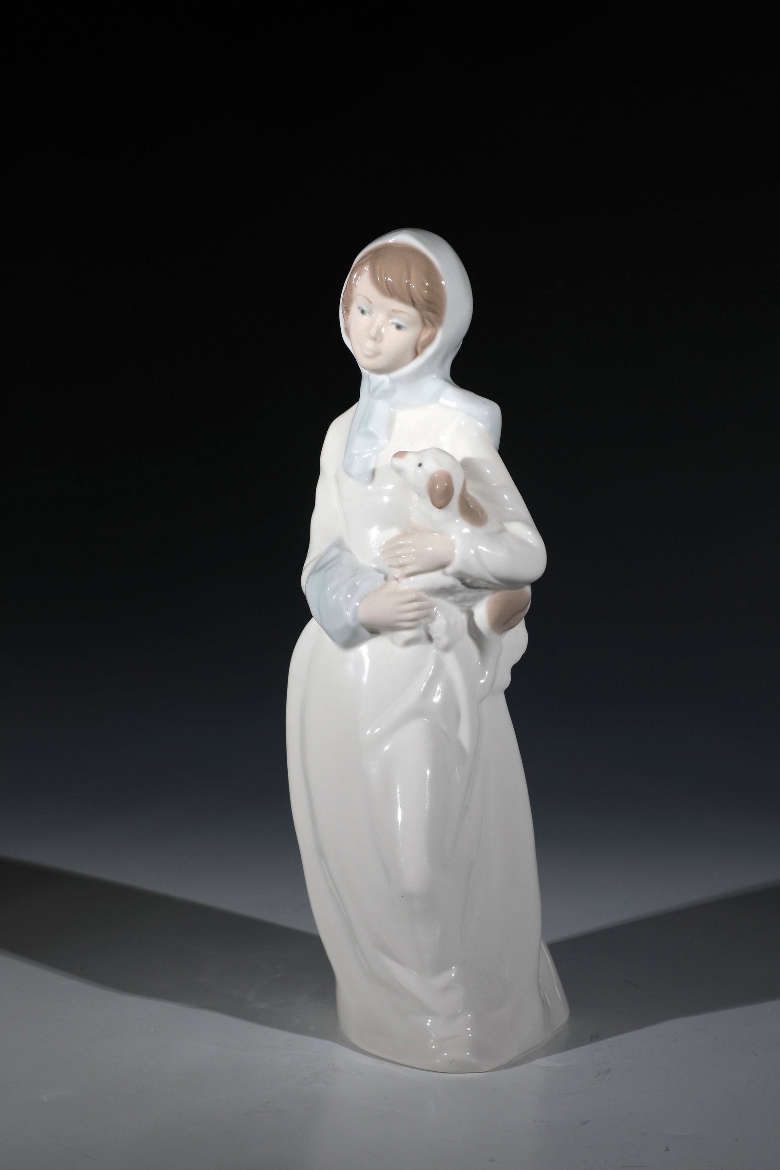 Girl with dog: Girl with Dog Diana, Spain, 20th Century Porcelain sparsely embellished. Unglazed back with manufactory mark. H. 29 cm. Mädchen mit Hund Diana, Spanien, 20. Jh. Porzellan sparsam staffiert.