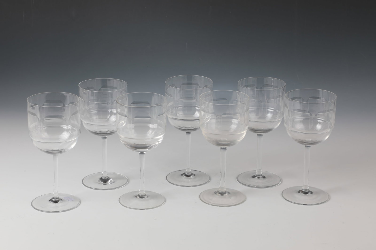 Set of Seven Wine Glasses ''Squares'': Set of seven wine glasses ''Squares'' Rosenthal, studio-linie, 1961-1999 Colorless crystal glass with a band of six engraved squares with wheel grinding on the outer wall. Company stamp on the base