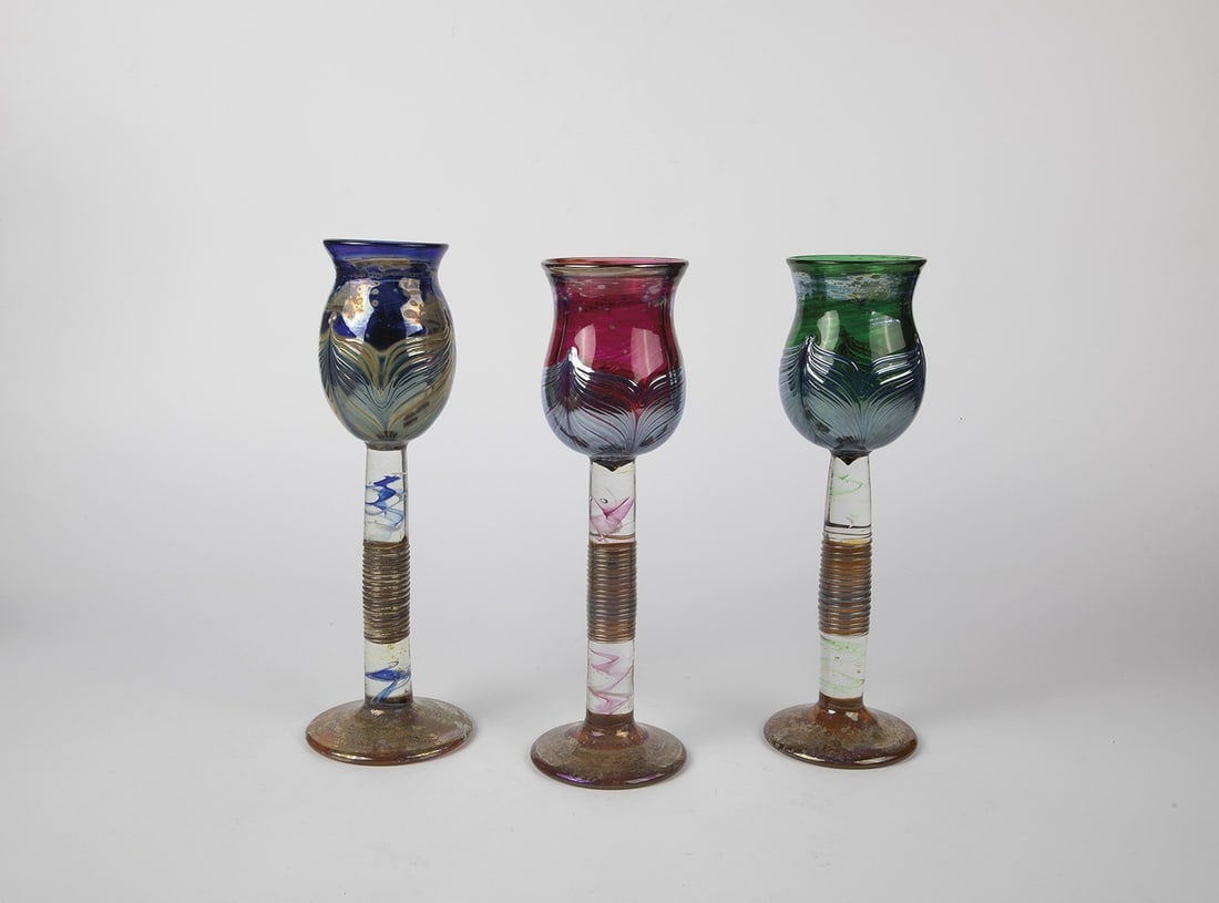 Three cup glasses: Three cup glasses Vaclav Stepaneck, Novy Bor, 1990s Colorless glass, crumb melting in red, blue and green. Applied silvery-blue feather decoration in roving technique. Lustrated. In the barrel