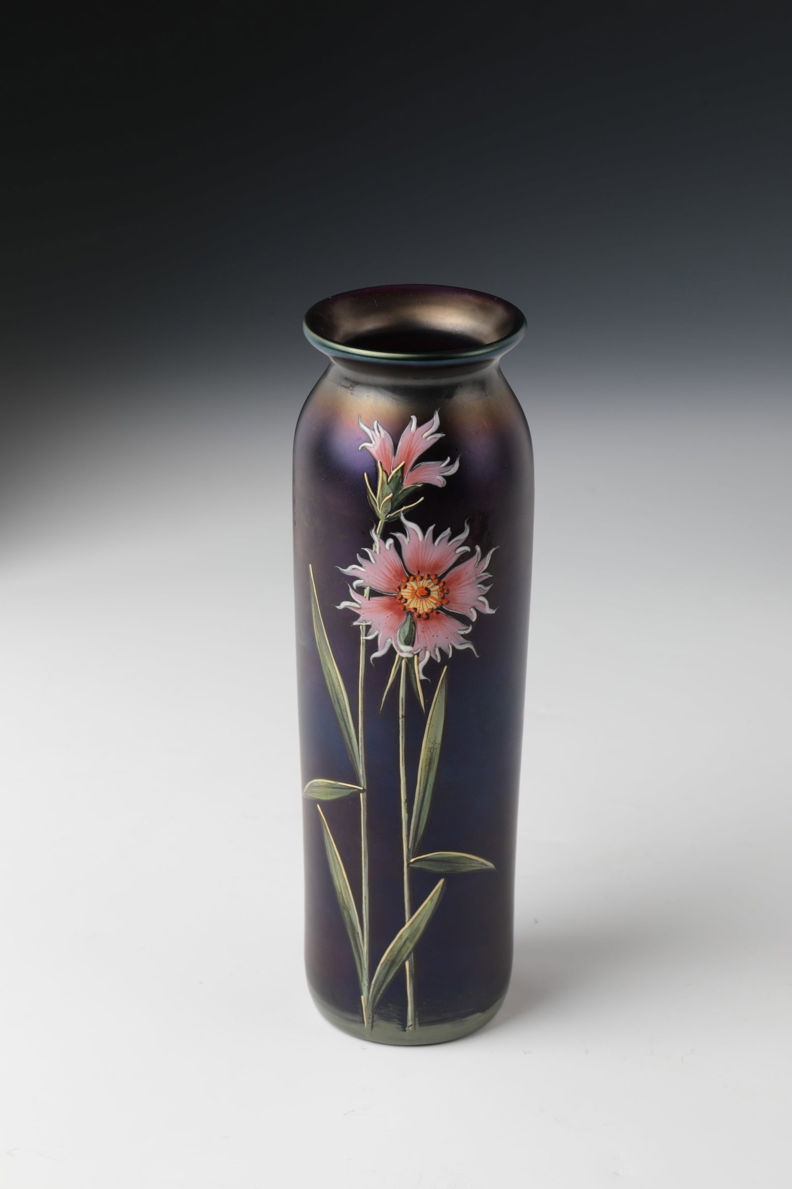 Rod vase with stone carnation: Rod vase with stone carnation Carl Schmoll von Eisenwert (design), Ferdinand von Poschinger, Glashüttenwerk Ilmenau, 1899 Dark violet glass with polychrome enamel painting: Blossoms. Buds and