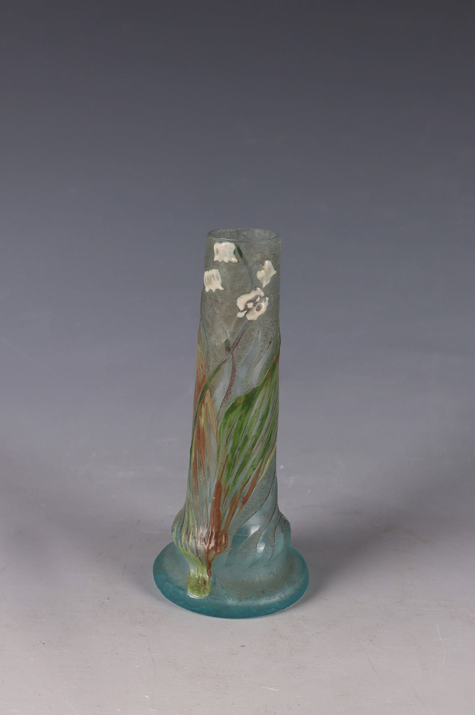 Small Long Neck Vase: Small Long-Neck Vase France, circa 1915 Colorless glass, with enclosed powder in white and light blue. Decoration etched in flat relief, painted in colourful enamel: branches with flowers and foliage