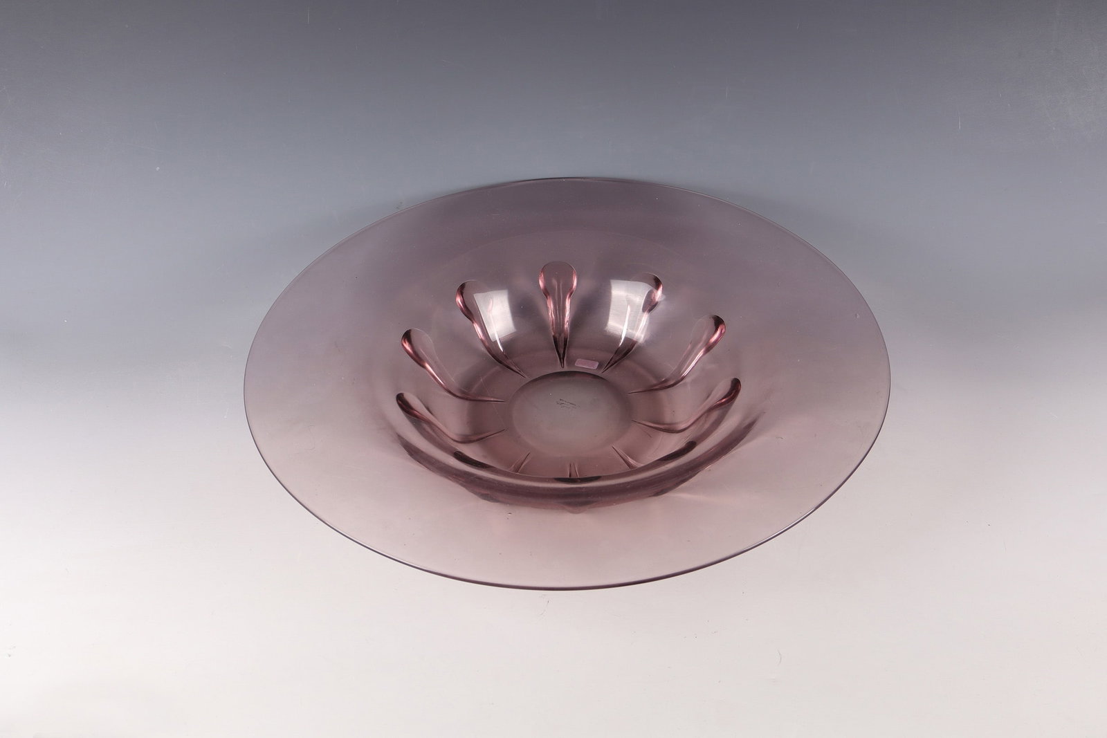Large bowl: Large bowl Les Andelys (''Verlys''), Paris and Les Andelys, c. 1930 Thin, pinkish-violet glass. Above the stand are ten round appliqués, also in pink violet, warped downwards. In the mirror