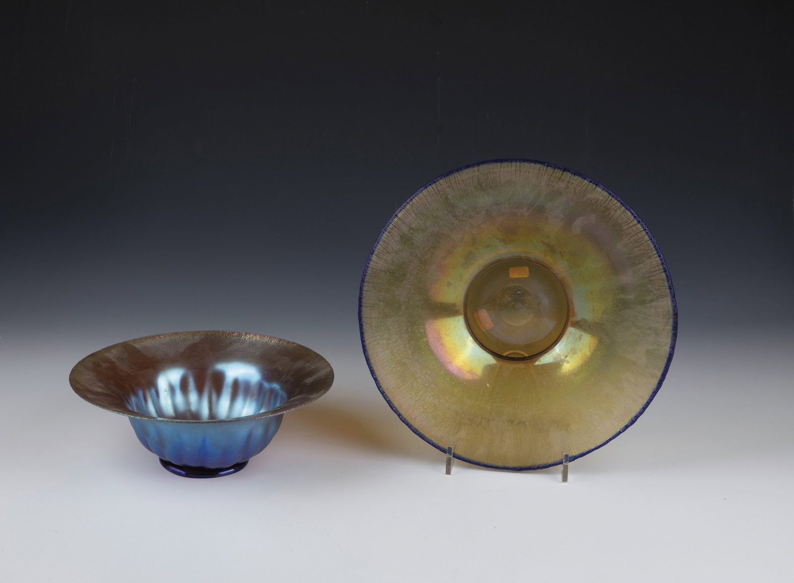Two bowls ''Myra Crystal'': Two bowls ''Myra-Kristall'' Karl Wiedmann (decorative technique), WMF, Geislingen, c. 1935 Colourless glass. Extensive yellow stained, reduced, iridescent and matt burned. D. 23.5 and 28.5 cm