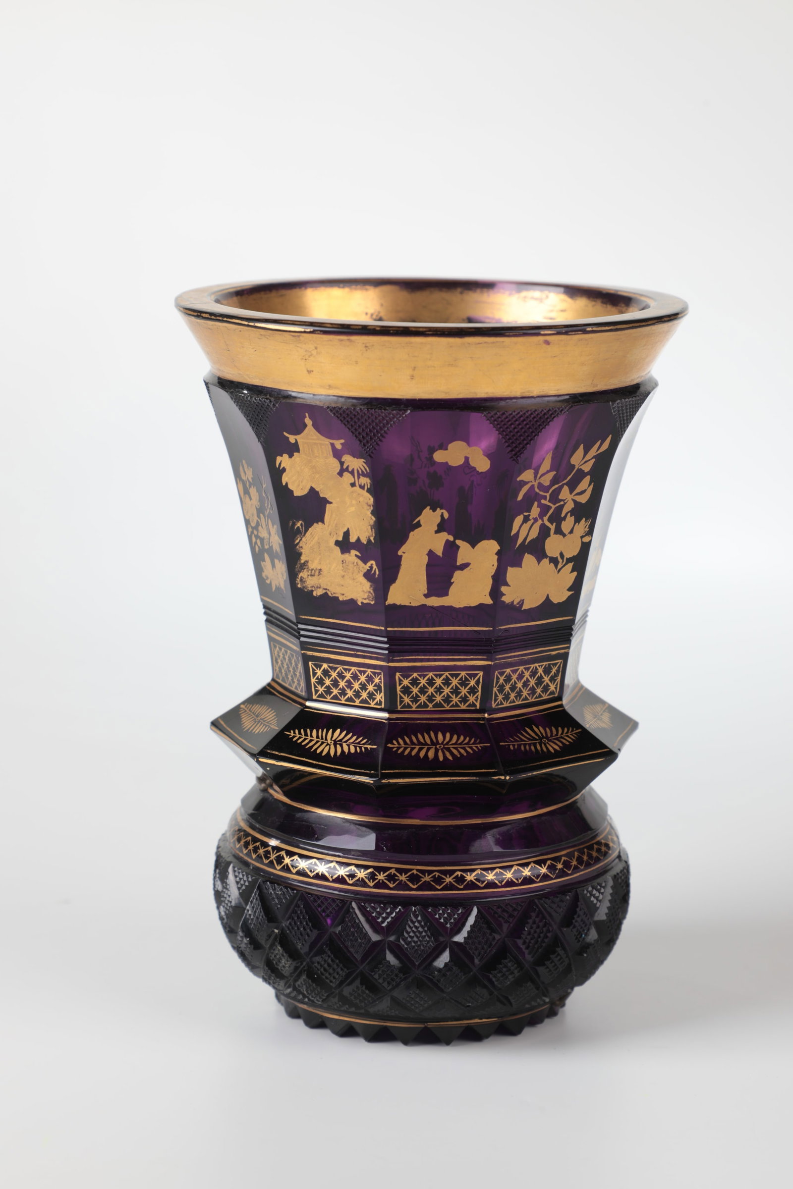 Large mug with chinoiseries: Large goblet with chinoiseries Bohemia, 19th century Violet glass with rich cut and gold decoration. On the faceted wall all around are representations of Chinese, birds, insects and flowers. Offset