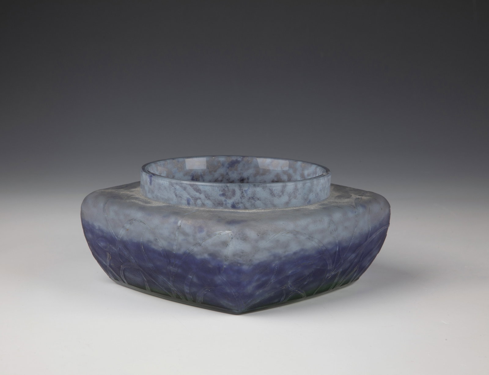 Shell: Bowl Daum Frères, Nancy, c. 1914 Colourless glass, with melted powder in green, violet and light blue. Wall with flat relief etched decoration: branches with flowers and foliage. Roughly etched