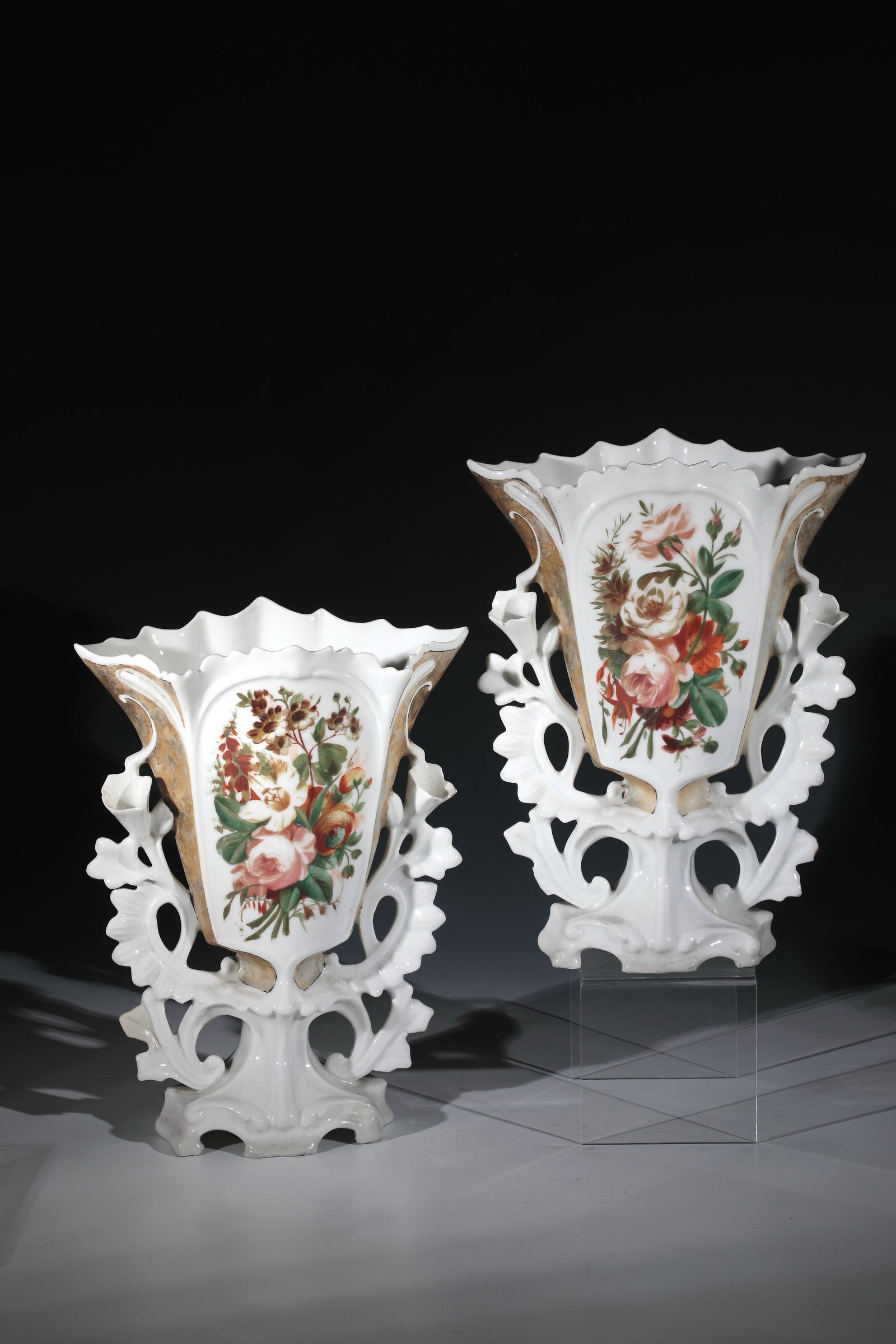 Pair of vases: Pair of vases, probably Thuringia, end of the 19th century, openworked, vegetable-worked ornamental handles. Bouquet of flowers in colourful on-glaze painting on the front. Damaged, restored. Stamped