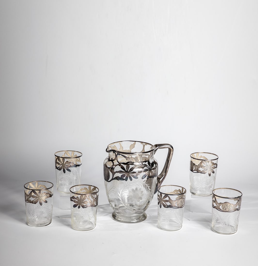 Seven-piece punch set: Seven-piece punch set Consisting of: punch bowl and six cups. Colourless glass with cut leaf and flower decoration as well as floral glavanised fine silver decoration and the initials ''DWB''. The