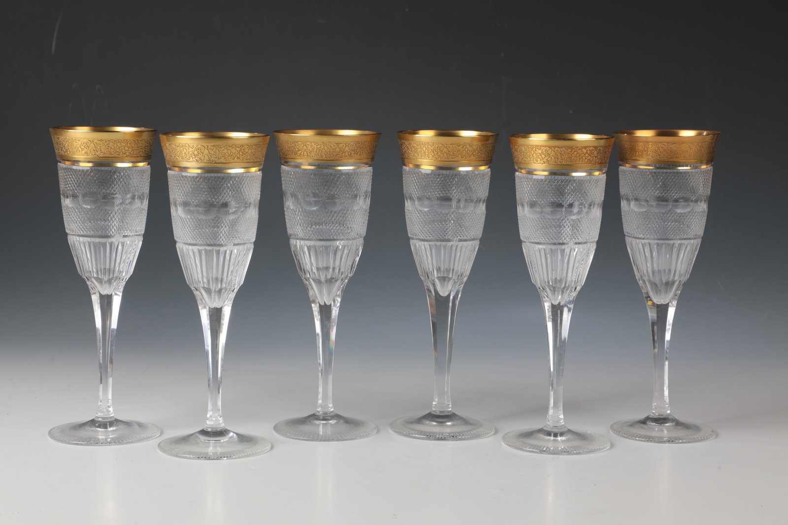 Six Champagne Flutes ''Splendid'': Six champagne flutes ''Splendid'' Ludwig Moser & Söhne, Karlsbad, c. 1911 Colourless glass, cut. Hexagonal stem. The lower part of the cuppa with a band of vertical wedge grinding, the