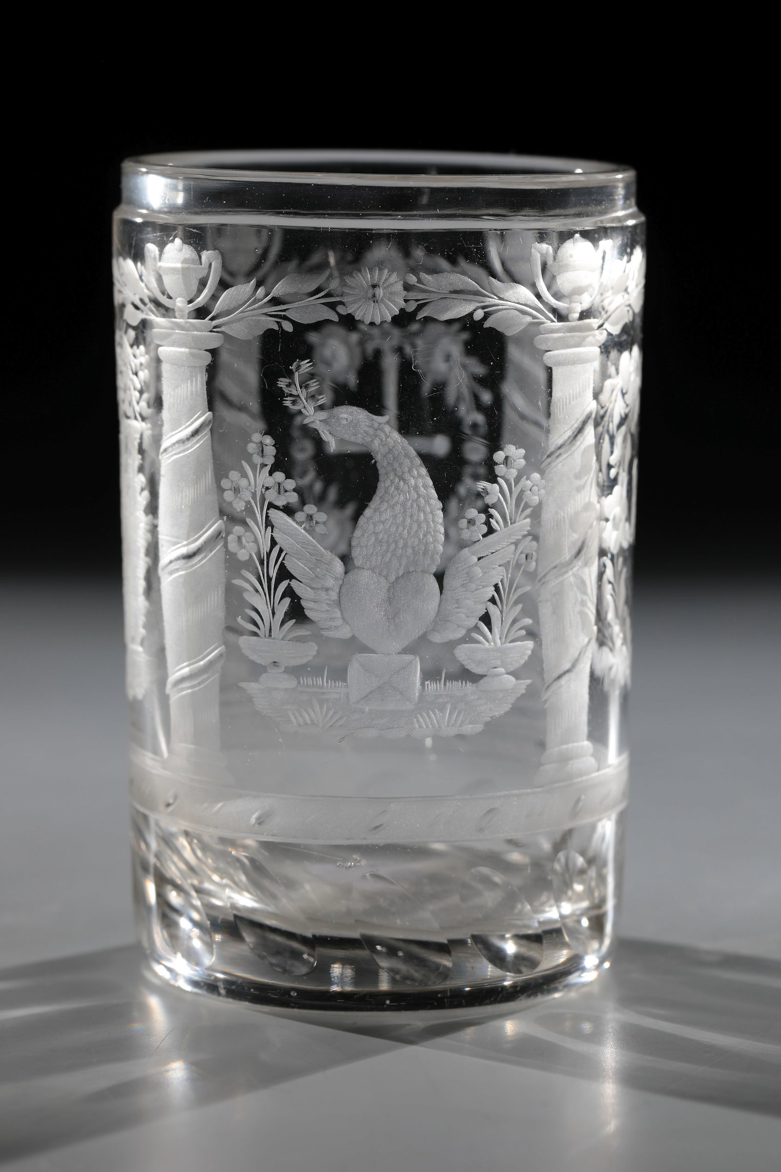 Cylinder beaker with allegorical representations: Cylinder beaker with allegorical depictions of Bohemia, 19th century Colourless glass. Approach of the cylindrical wall with olive-cut border. Frontal initials ''M.E.'' as well as between columns in
